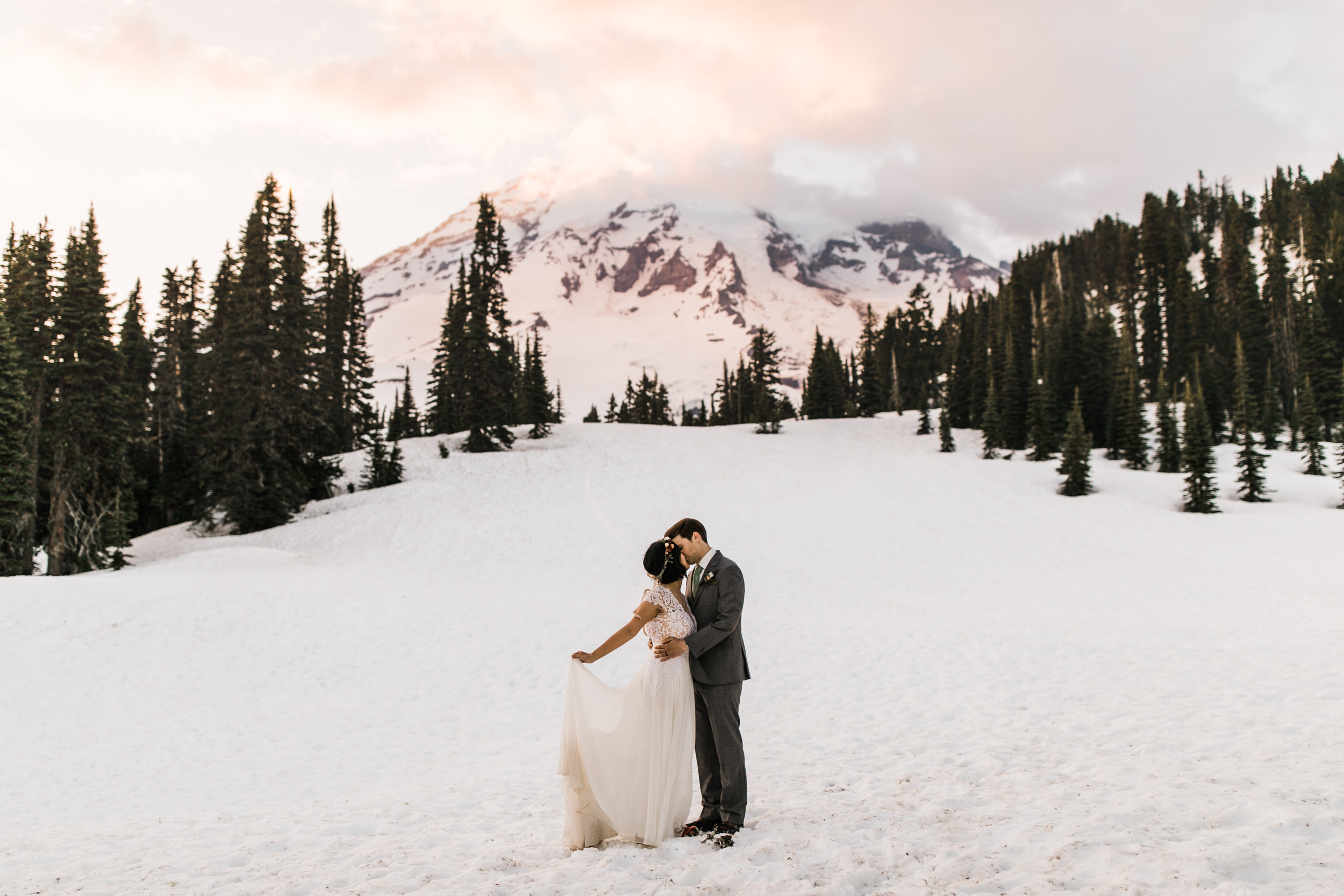 intimate wedding and reception in mount rainier national park | a frame cabin elopement first look | woodsy small reception in washington | snowy wedding portraits | elopement in the mountains