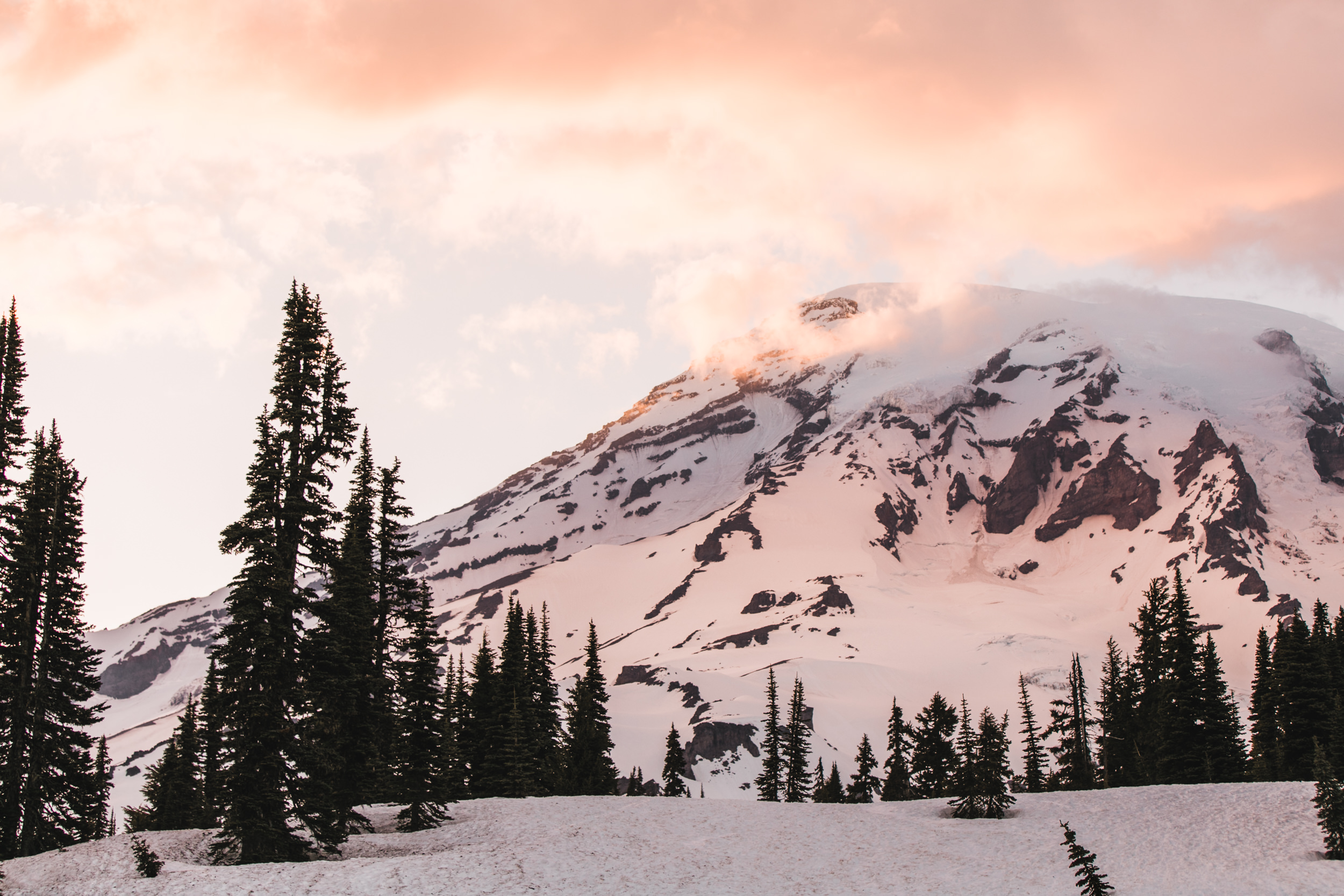 intimate wedding and reception in mount rainier national park | a frame cabin elopement first look | woodsy small reception in washington | snowy wedding portraits | elopement in the mountains