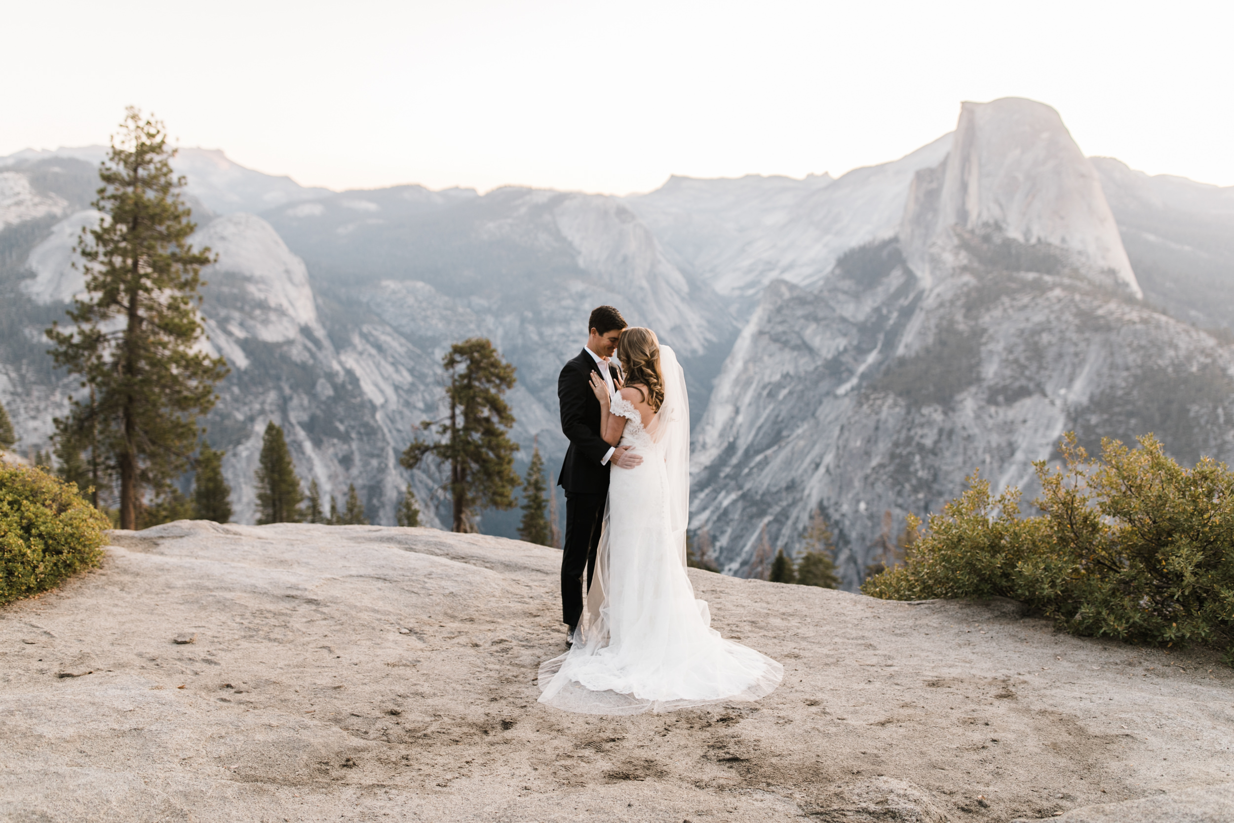 first look and wedding portraits at glacier point | bride and groom with a dog | yosemite national park elopement photographer | the hearnes adventure photography 