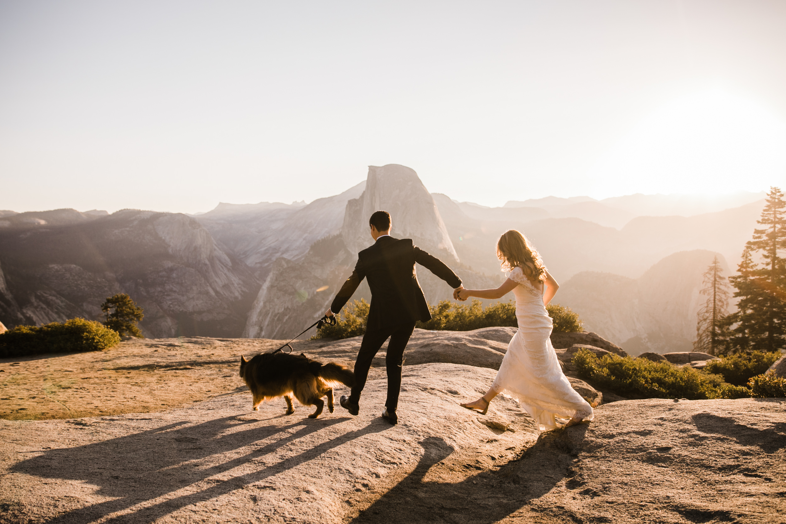 first look and wedding portraits at glacier point | bride and groom with a dog | yosemite national park elopement photographer | the hearnes adventure photography 