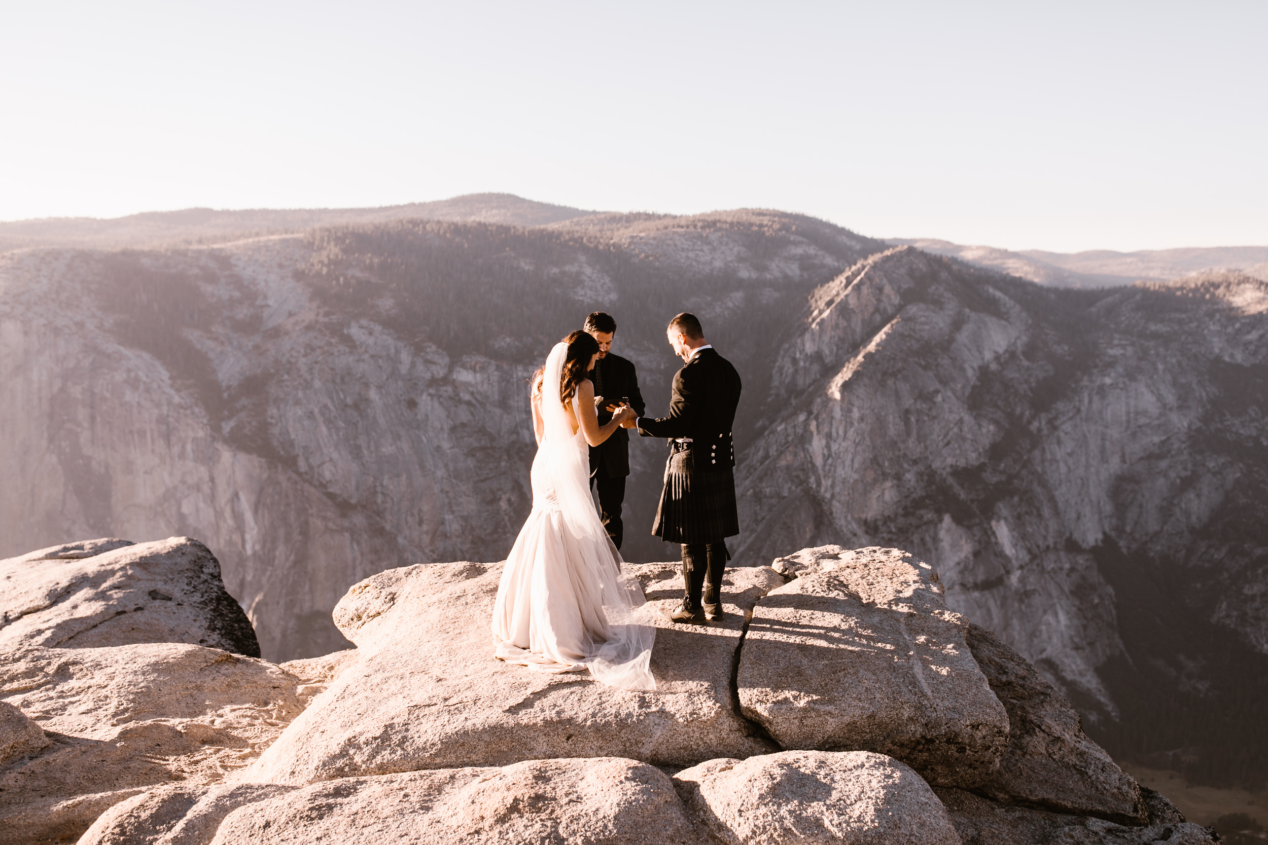 destination elopement in yosemite national park | ceremony + portraits at taft point | groom wearing a kilt + bride wearing boots | the hearnes elopement photography