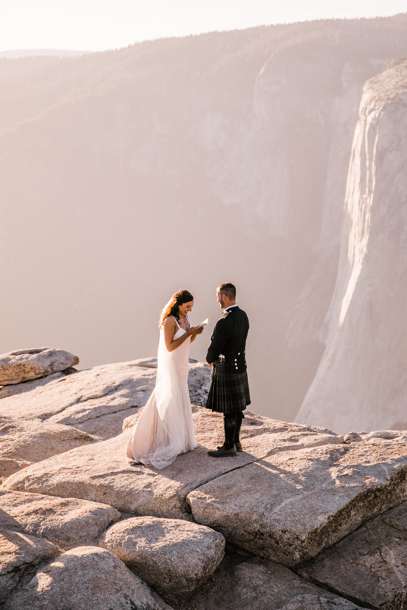 destination elopement in yosemite national park | ceremony + portraits at taft point | groom wearing a kilt + bride wearing boots | the hearnes elopement photography