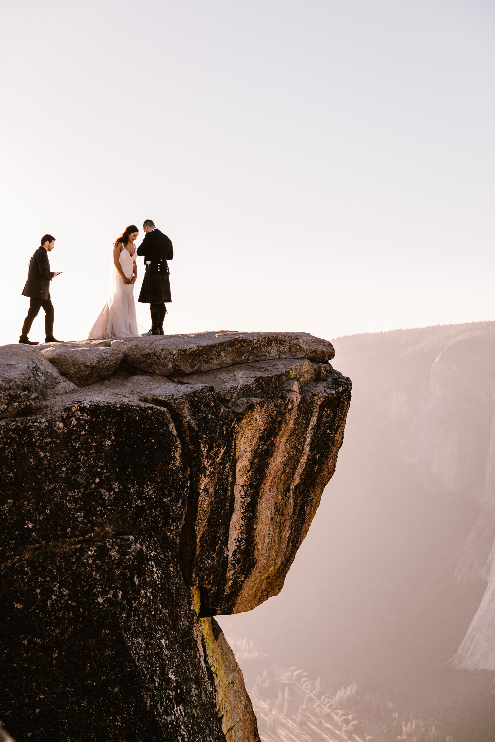 destination elopement in yosemite national park | ceremony + portraits at taft point | groom wearing a kilt + bride wearing boots | the hearnes elopement photography