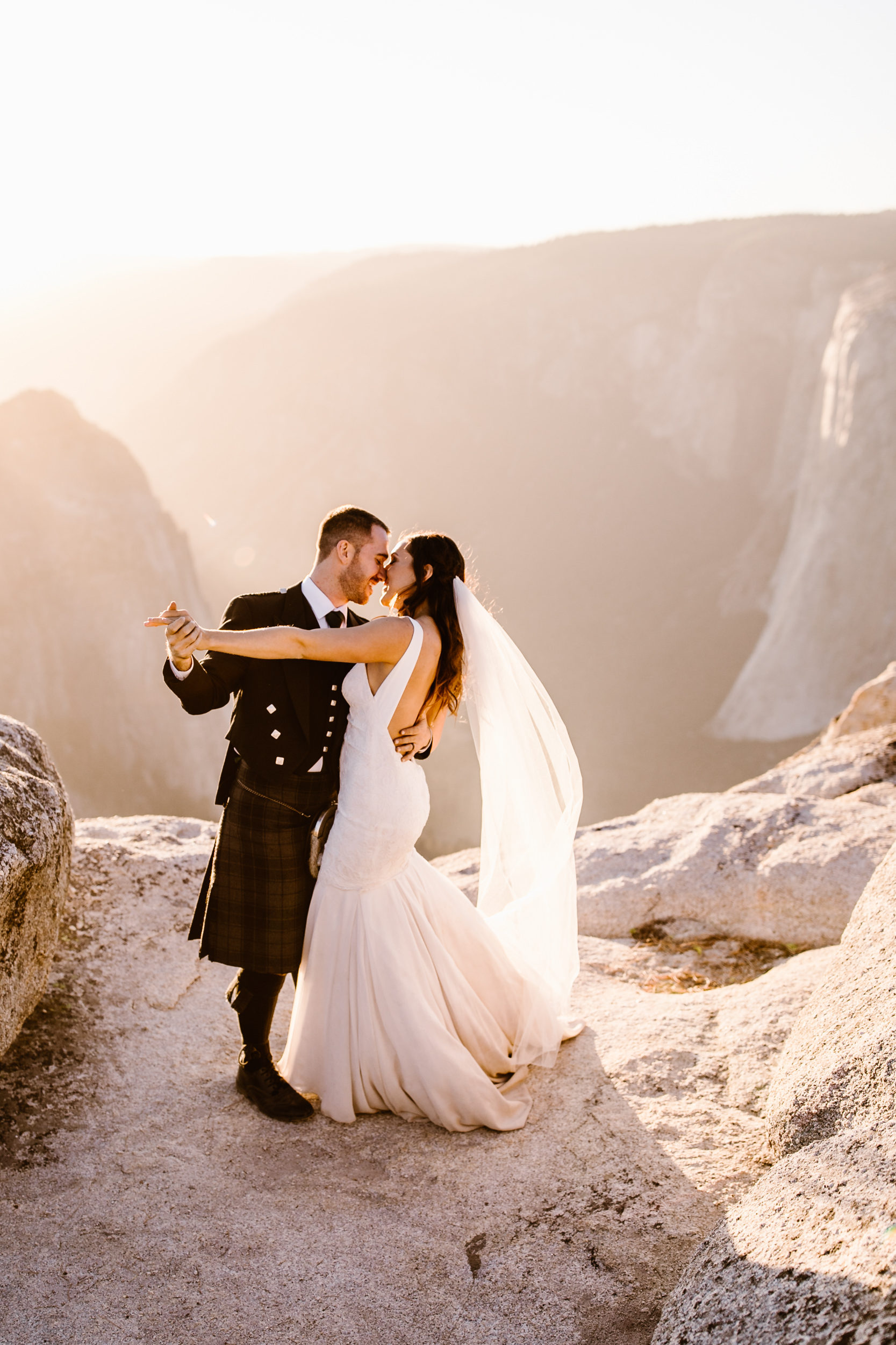 destination elopement in yosemite national park | ceremony + portraits at taft point | groom wearing a kilt + bride wearing boots | the hearnes elopement photography