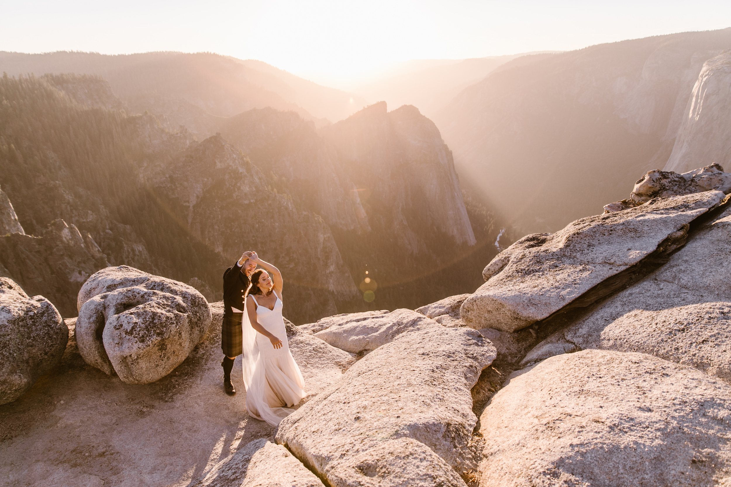 destination elopement in yosemite national park | ceremony + portraits at taft point | groom wearing a kilt + bride wearing boots | the hearnes elopement photography