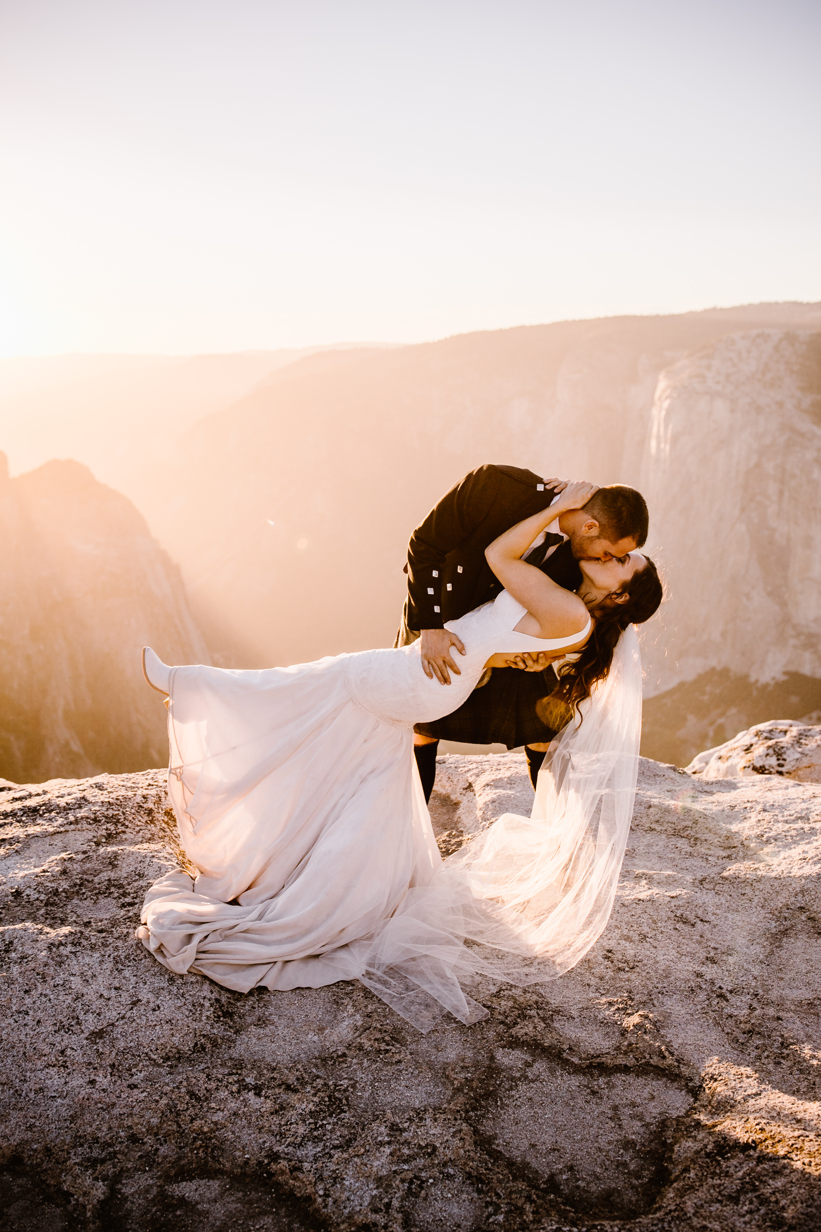 destination elopement in yosemite national park | ceremony + portraits at taft point | groom wearing a kilt + bride wearing boots | the hearnes elopement photography