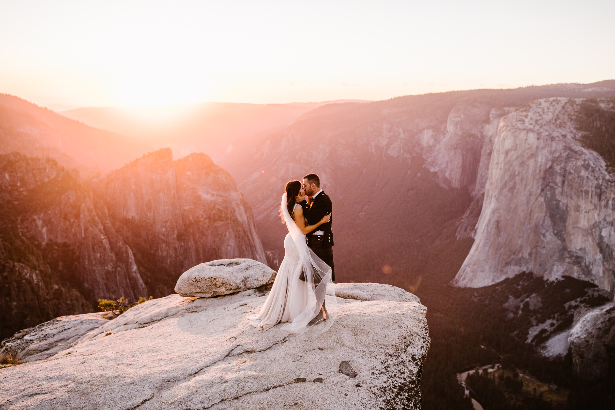 destination elopement in yosemite national park | ceremony + portraits at taft point | groom wearing a kilt + bride wearing boots | the hearnes elopement photography