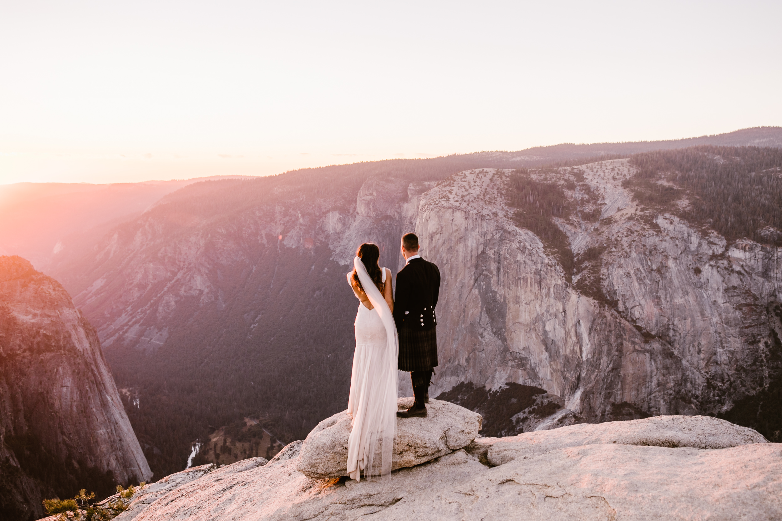 destination elopement in yosemite national park | ceremony + portraits at taft point | groom wearing a kilt + bride wearing boots | the hearnes elopement photography