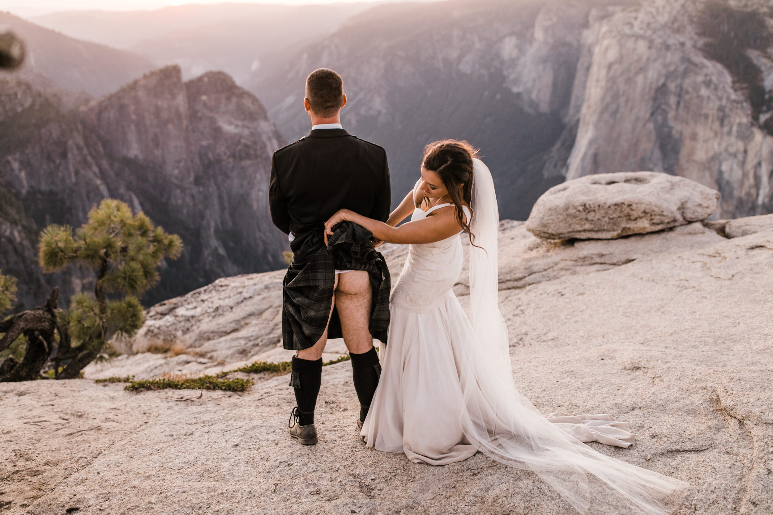 destination elopement in yosemite national park | ceremony + portraits at taft point | groom wearing a kilt + bride wearing boots | the hearnes elopement photography