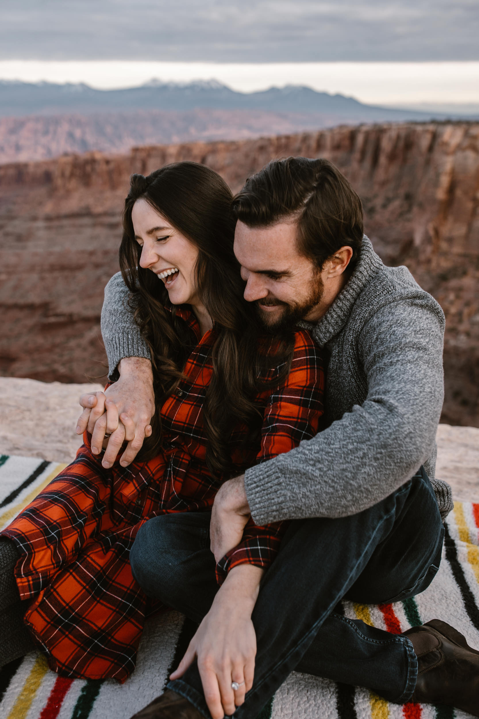 van life engagement photos | outdoor picnic in Moab, Utah | charcuterie and wine in the desert | the hearnes adventure photography