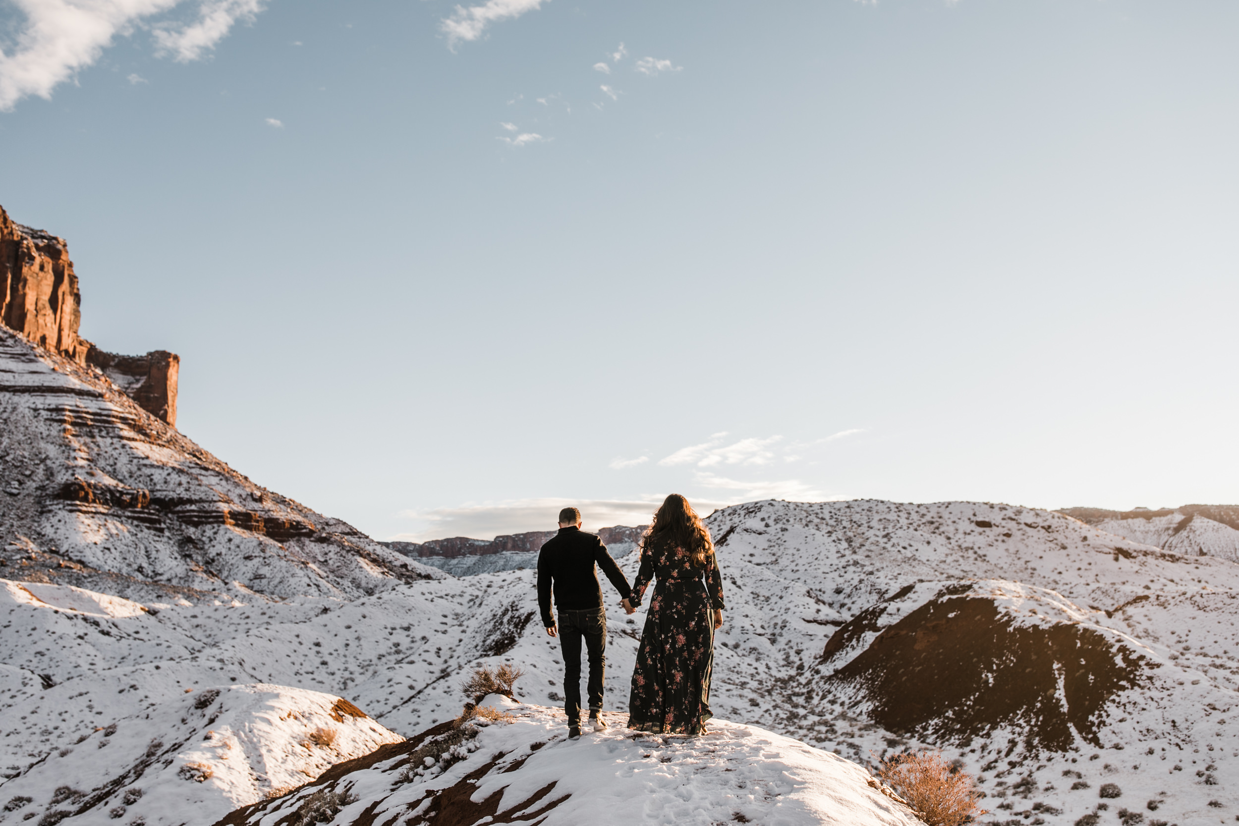 snowy engagement session in moab, utah with dogs