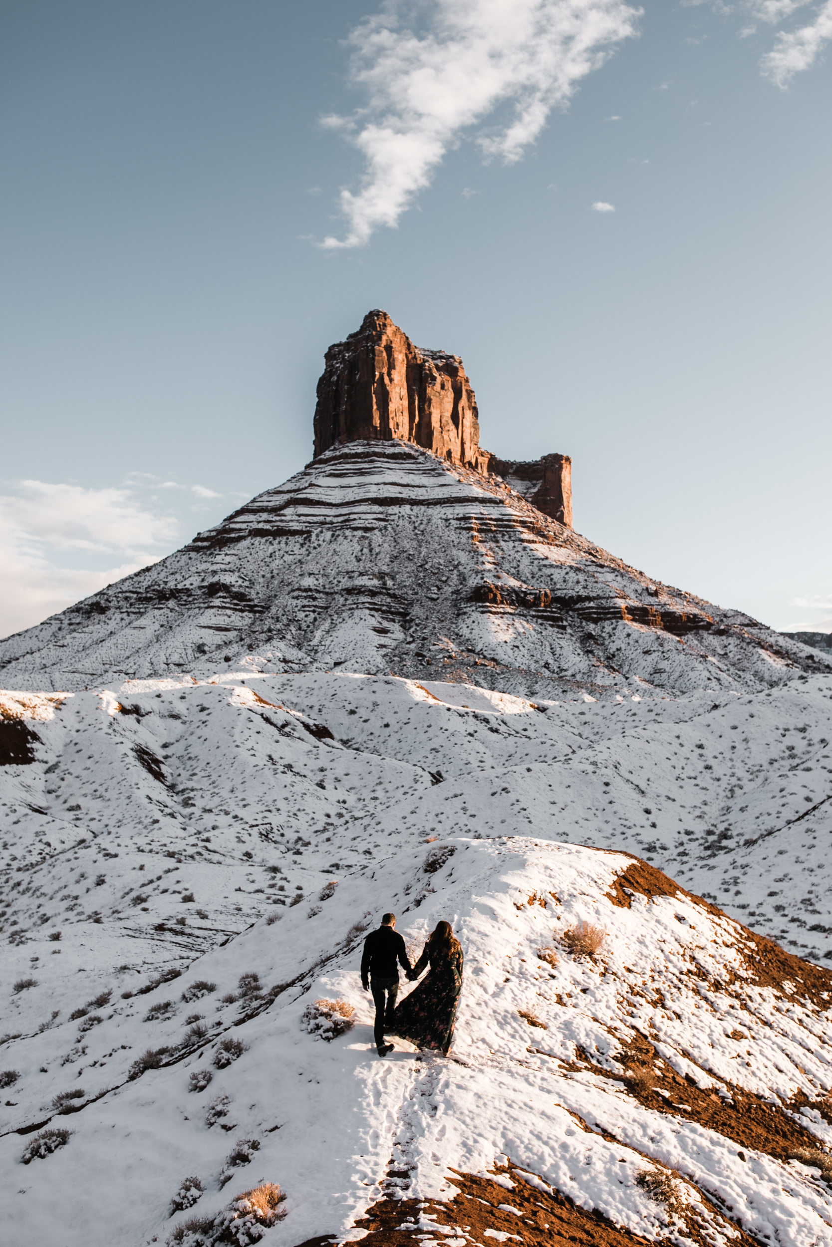 snowy engagement session in moab, utah with dogs