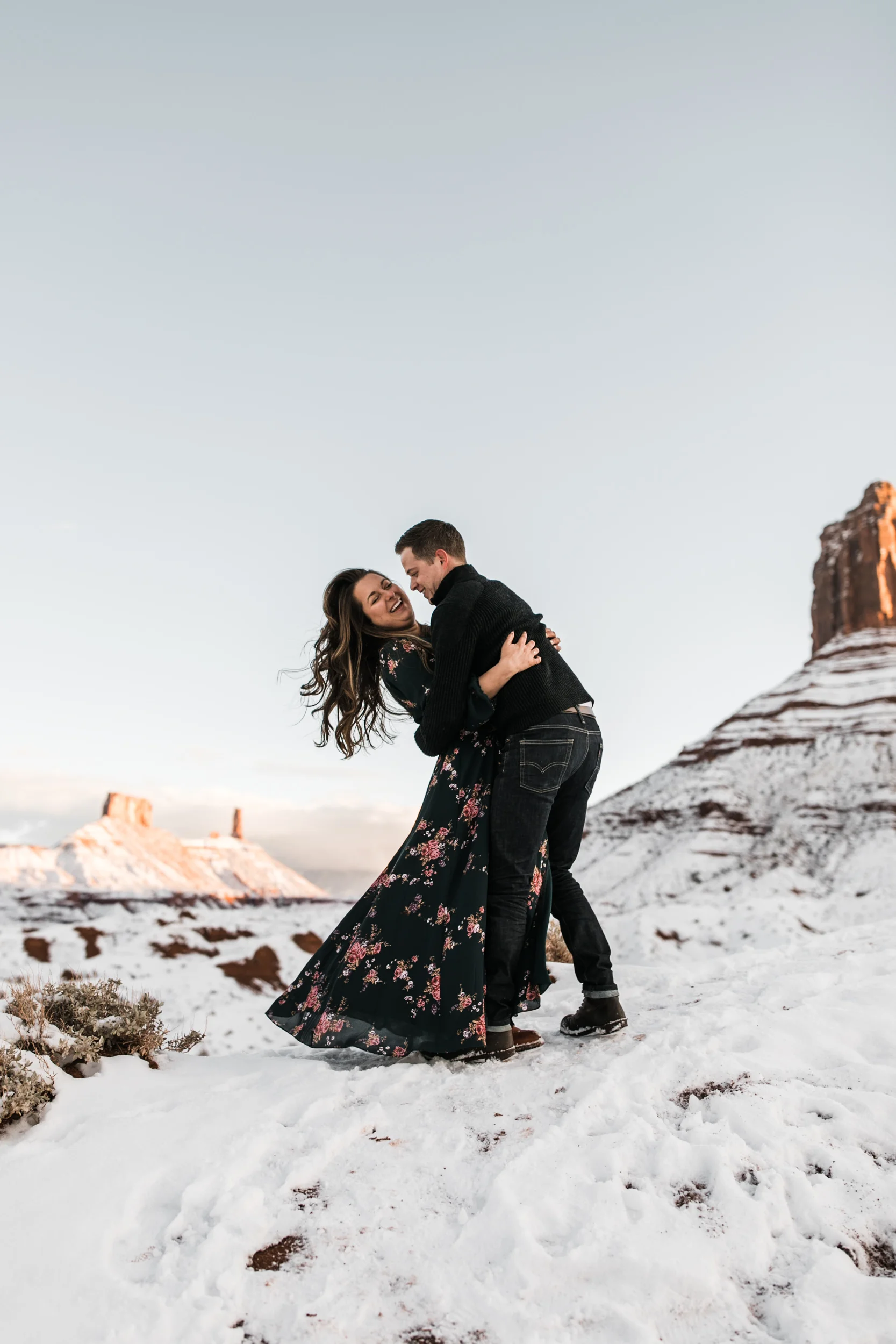 snowy engagement session in moab, utah with dogs