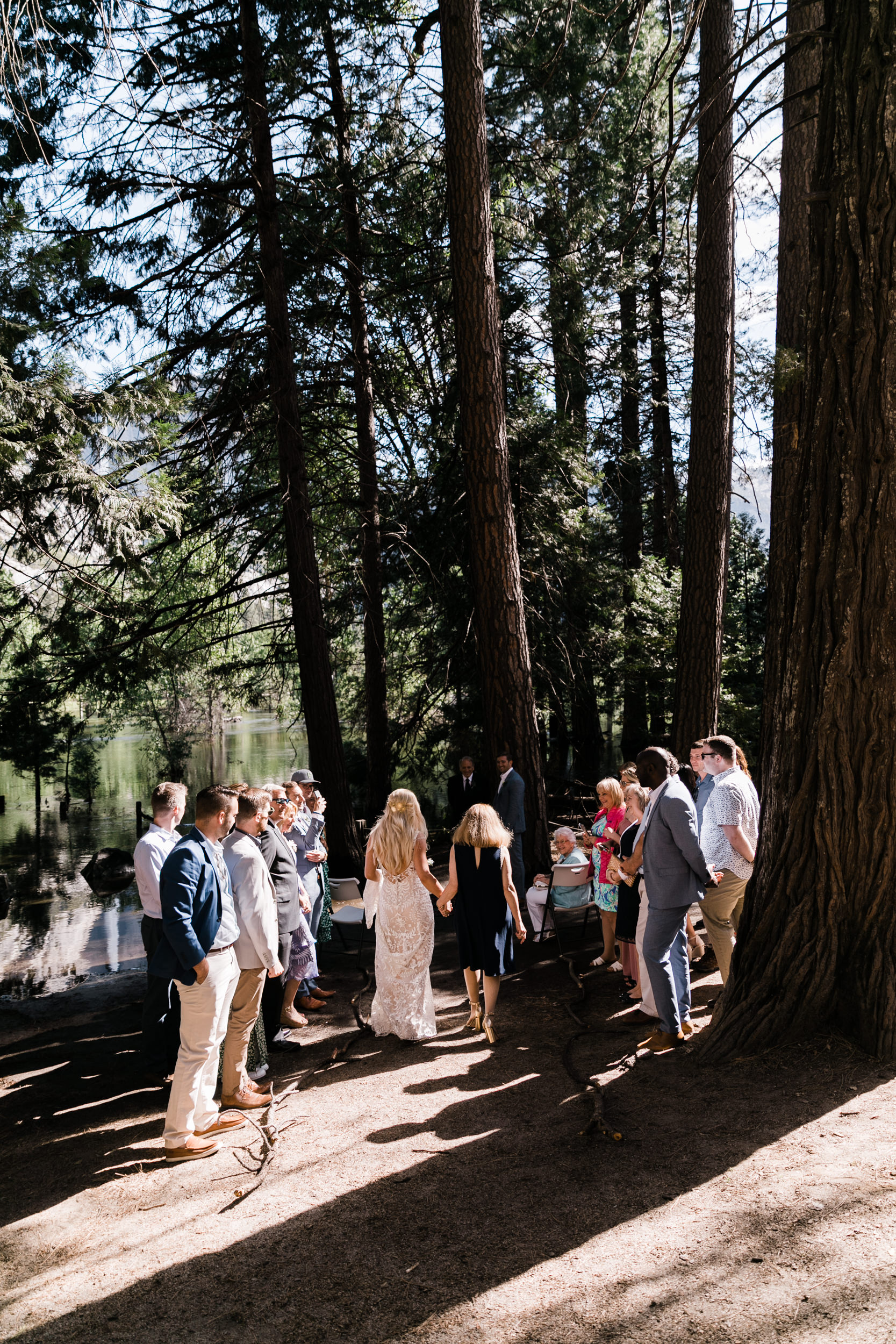 Erika + Grant’s intimate Yosemite National Park destination wedding + romantic backyard reception under twinkle lights | ceremony in the woods in yosemite valley | the hearnes adventure photography