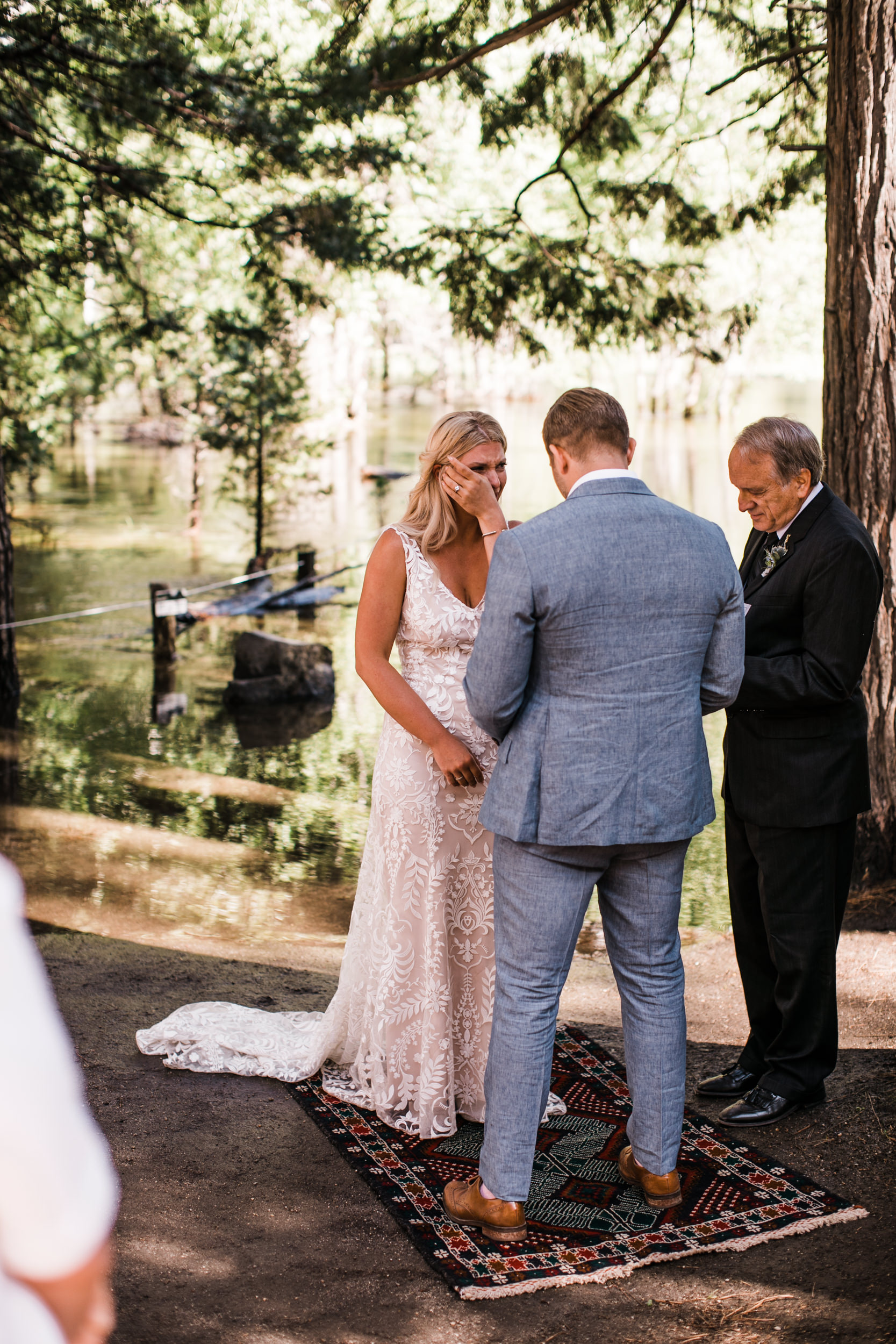 Erika + Grant’s intimate Yosemite National Park destination wedding + romantic backyard reception under twinkle lights | ceremony in the woods in yosemite valley | the hearnes adventure photography