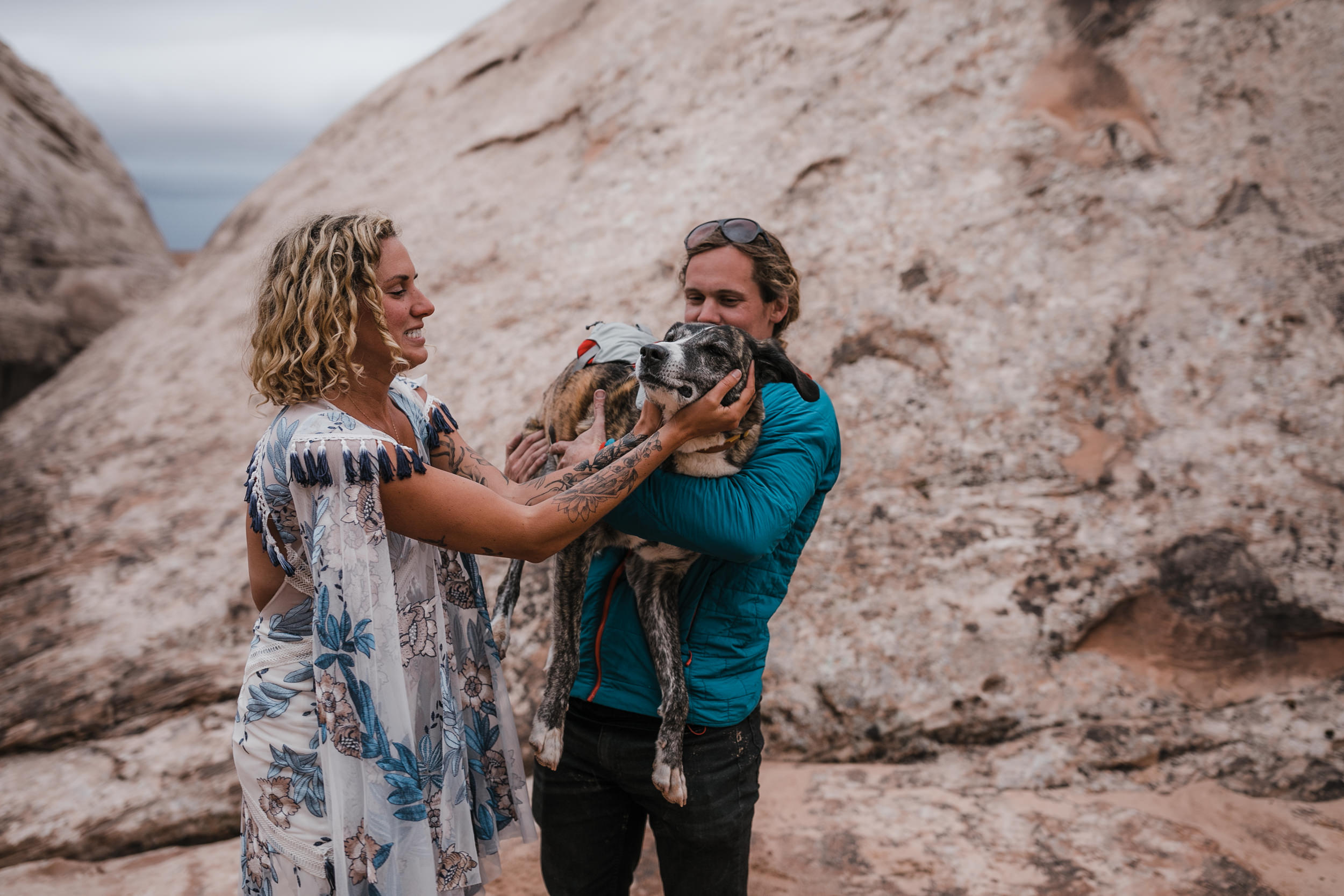 keith and brianna madia and their dogs bucket and dagwood in the utah desert | canyoneering adventure wedding | rue de seine aegean wedding gown in indigo