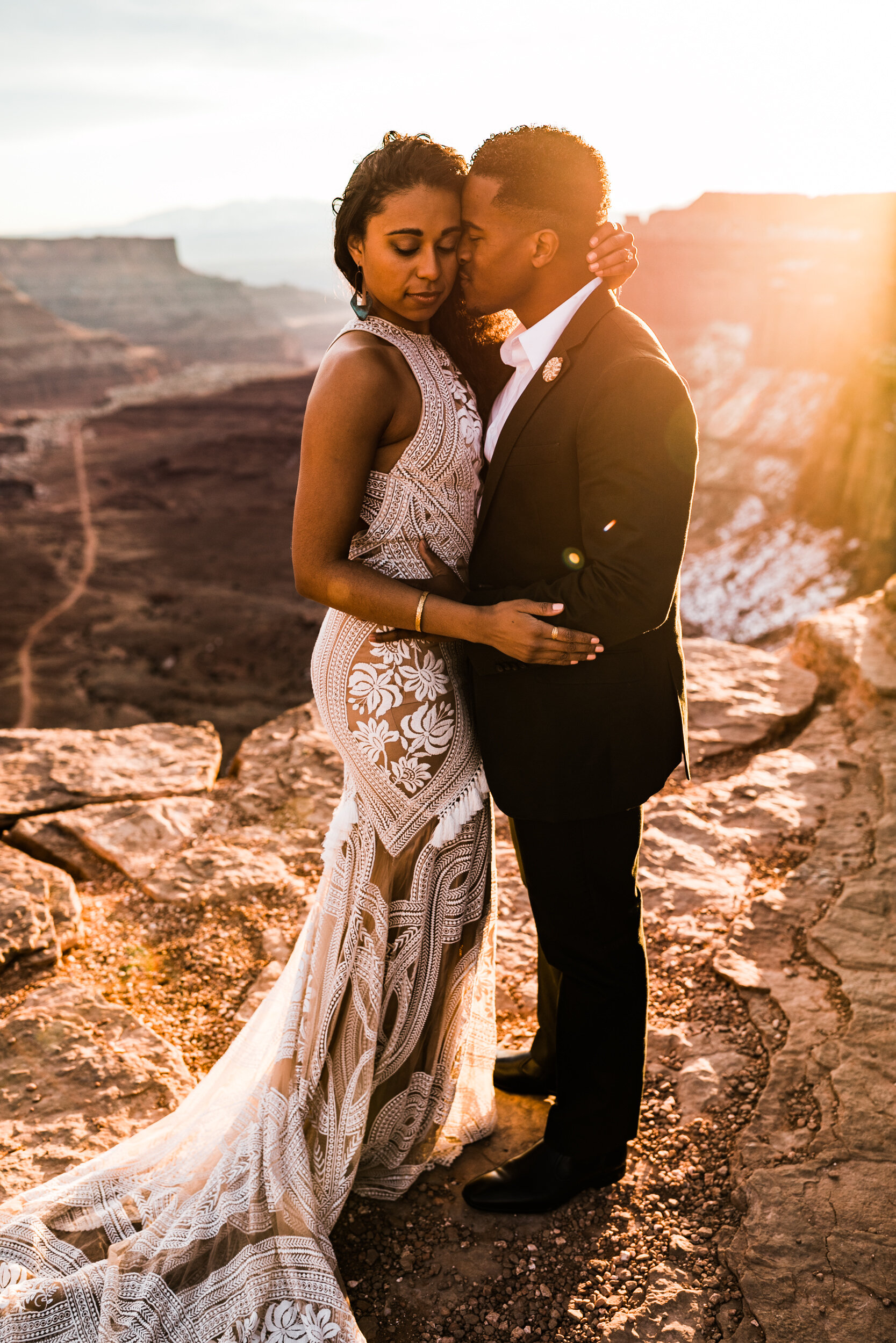 This Moab Elopement in Canyonlands National Park is major desert wedding inspiration! A surprise proposal at sunrise and Rue De Seine East Gown by The Hearnes Adventure Photography