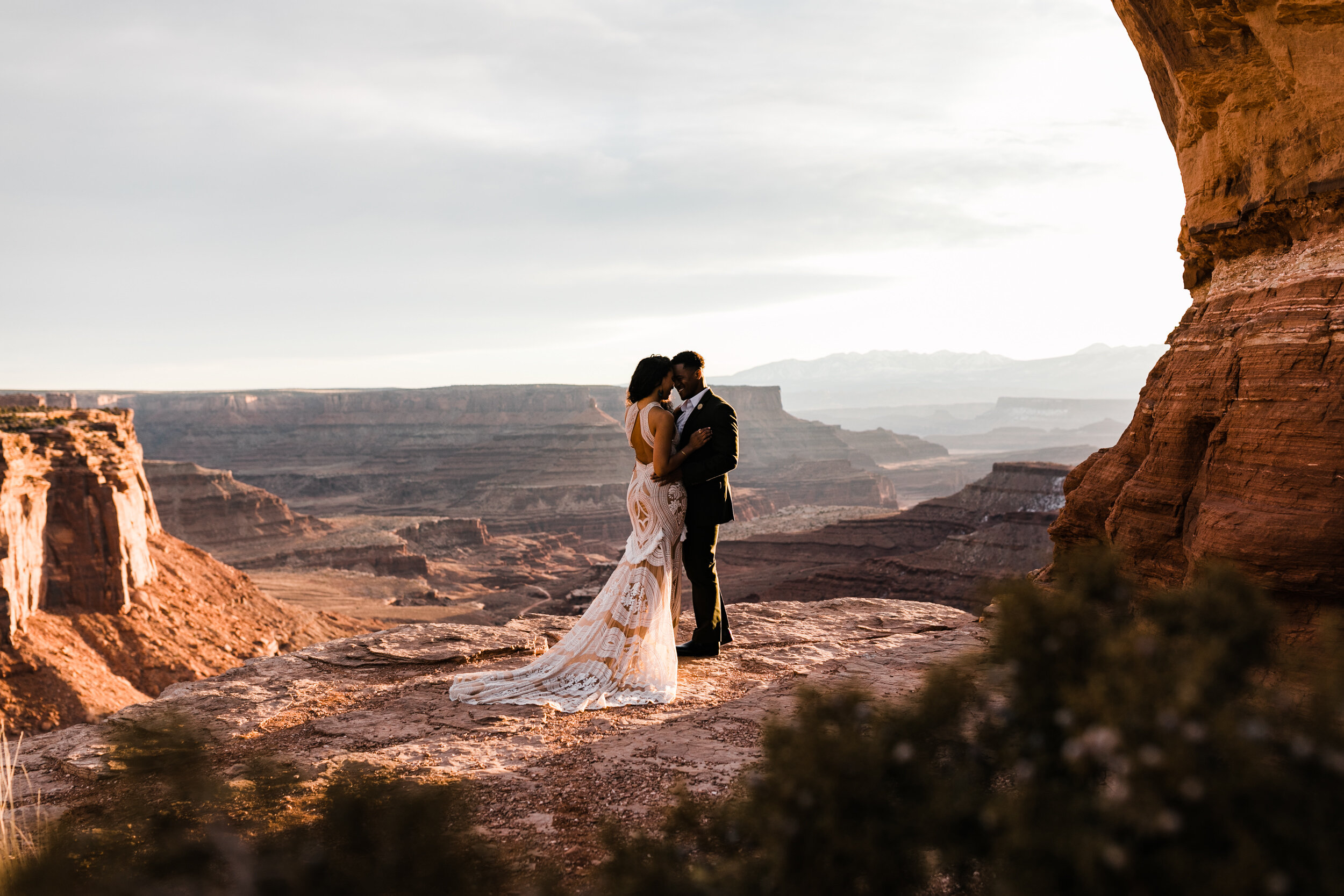 This Moab Elopement in Canyonlands National Park is major desert wedding inspiration! A surprise proposal at sunrise and Rue De Seine East Gown by The Hearnes Adventure Photography