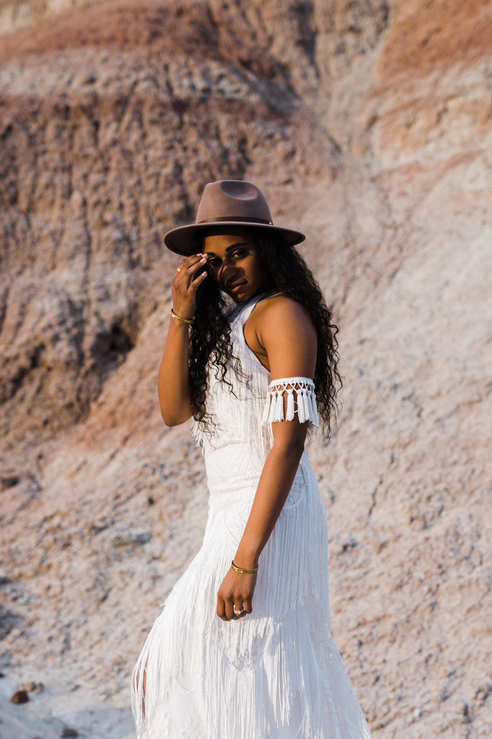 Moab Elopement Photographer | The Hearnes | Rue de Seine Dallas Gown | Bohemian Bride Fringe Wedding Dress &amp; Groom’s Burgundy Suit