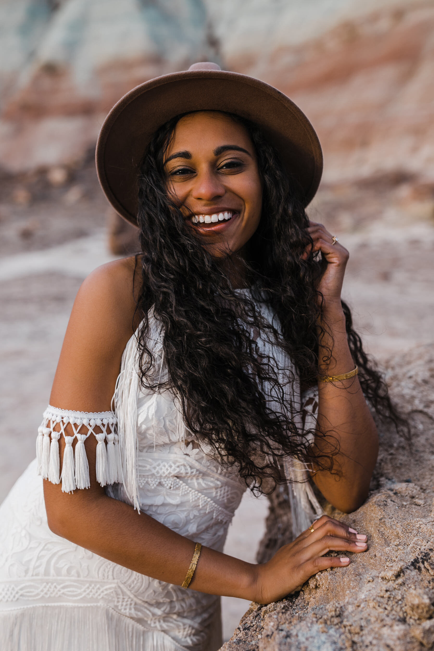 Moab Elopement Photographer | The Hearnes | Rue de Seine Dallas Gown | Bohemian Bride Fringe Wedding Dress &amp; Groom’s Burgundy Suit