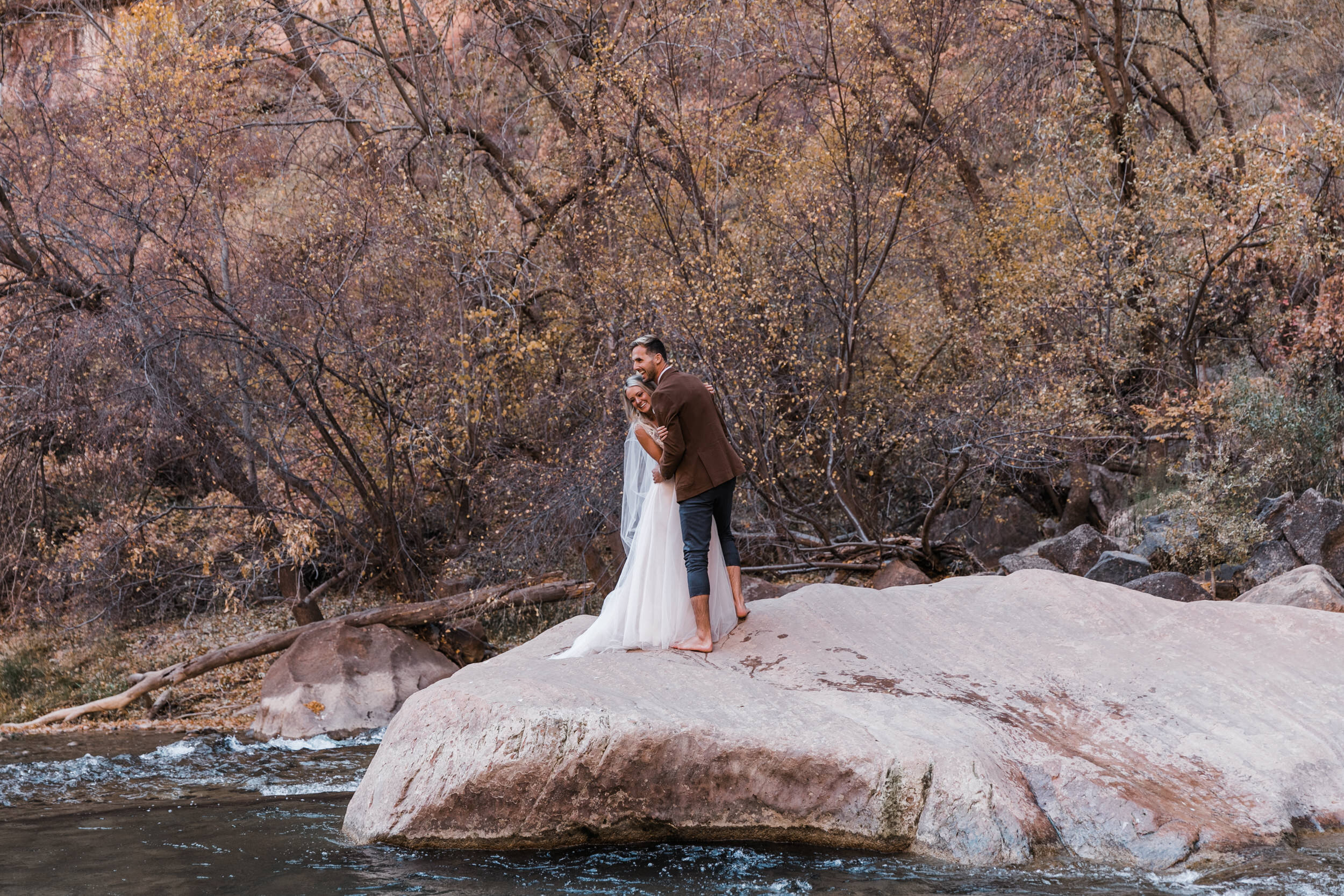 Fall Elopement in Zion National Park | Sunrise Yoga at Under Canvas Zion | Wedding Reception at Lazalu | Sunrise Adventure Session | Opal Milk Fringe Bride Jacket | The Hearnes Elopement Photographers