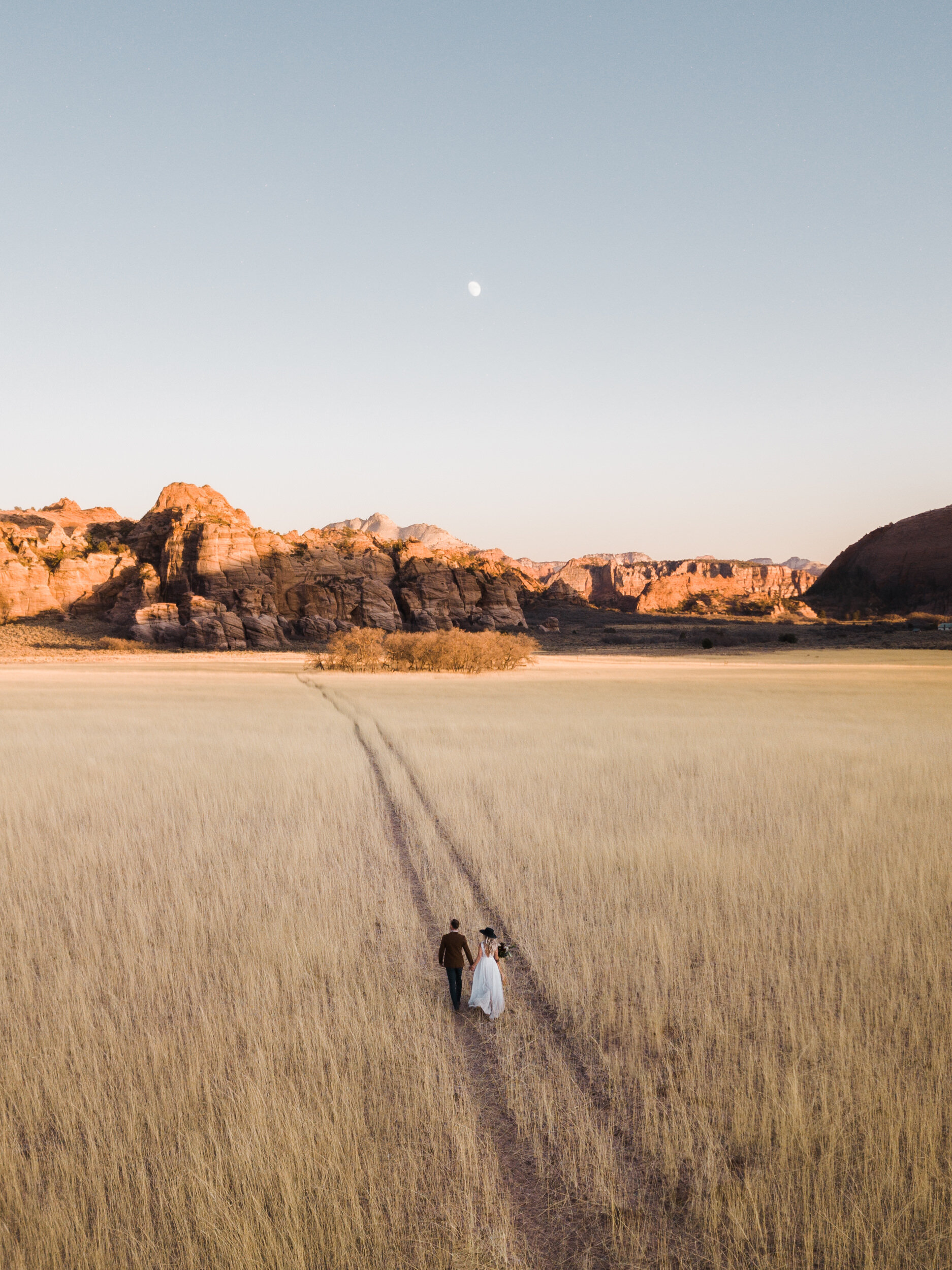 Fall Elopement in Zion National Park | Sunrise Yoga at Under Canvas Zion | Wedding Reception at Lazalu | Sunrise Adventure Session | Opal Milk Fringe Bride Jacket | The Hearnes Elopement Photographers