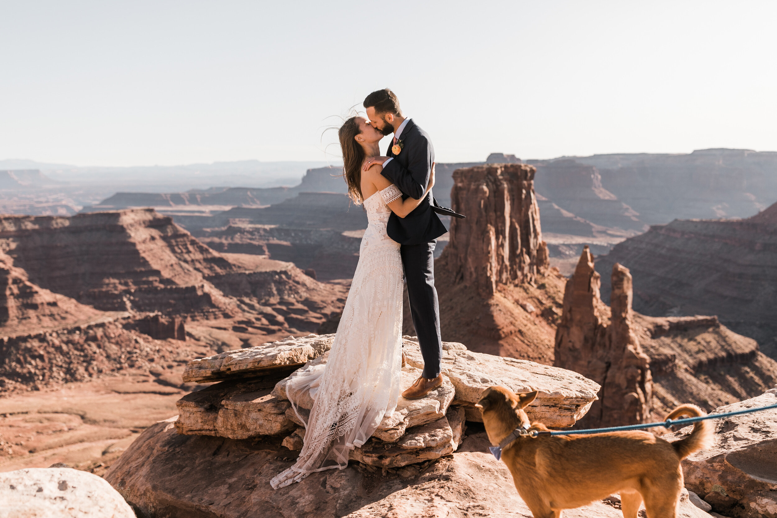 Adventurous jeep elopement in Moab, Utah | Rue de Seine Boho Desert Bride | Maroon Suit | Wedding with a dog | The Hearnes Adventure Photography