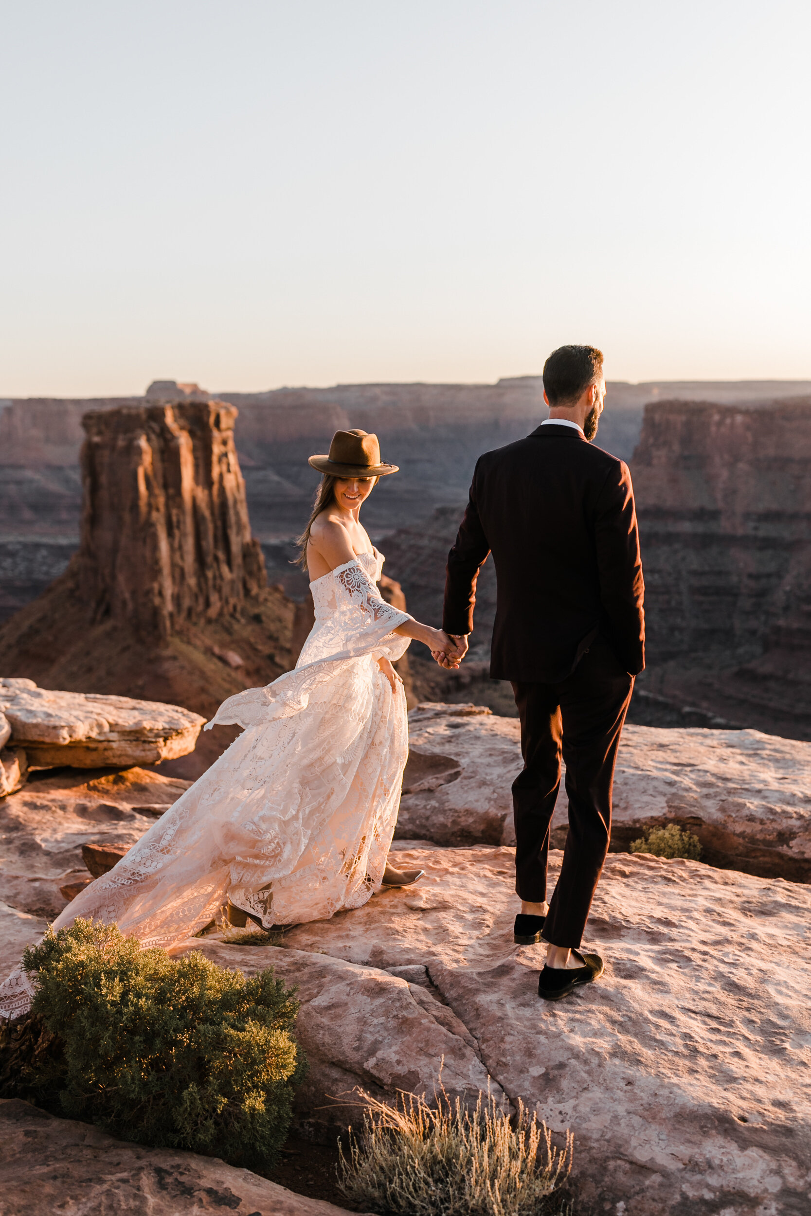 Adventurous jeep elopement in Moab, Utah | Rue de Seine Boho Desert Bride | Maroon Suit | Wedding with a dog | The Hearnes Adventure Photography