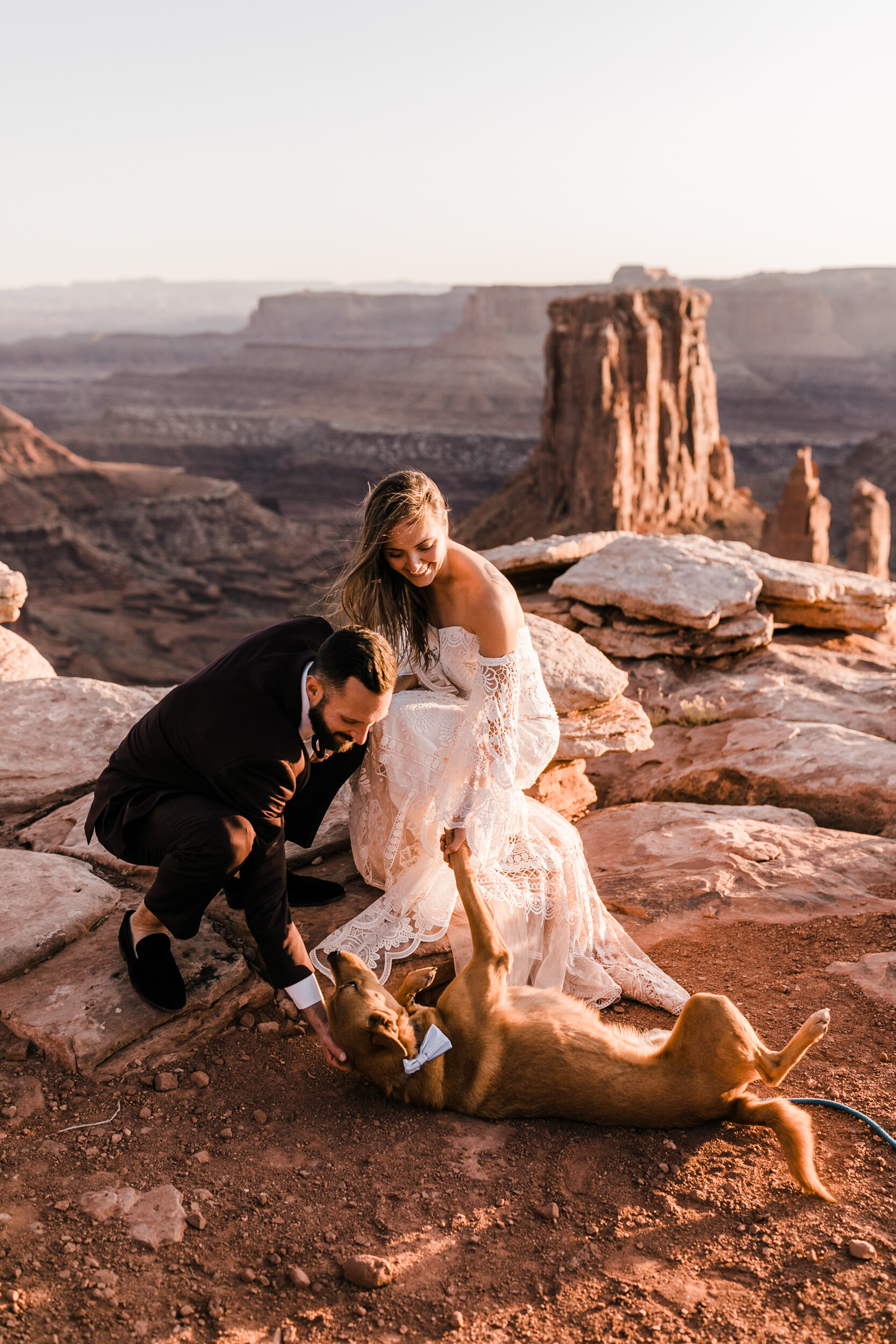 Adventurous jeep elopement in Moab, Utah | Rue de Seine Boho Desert Bride | Maroon Suit | Wedding with a dog | The Hearnes Adventure Photography