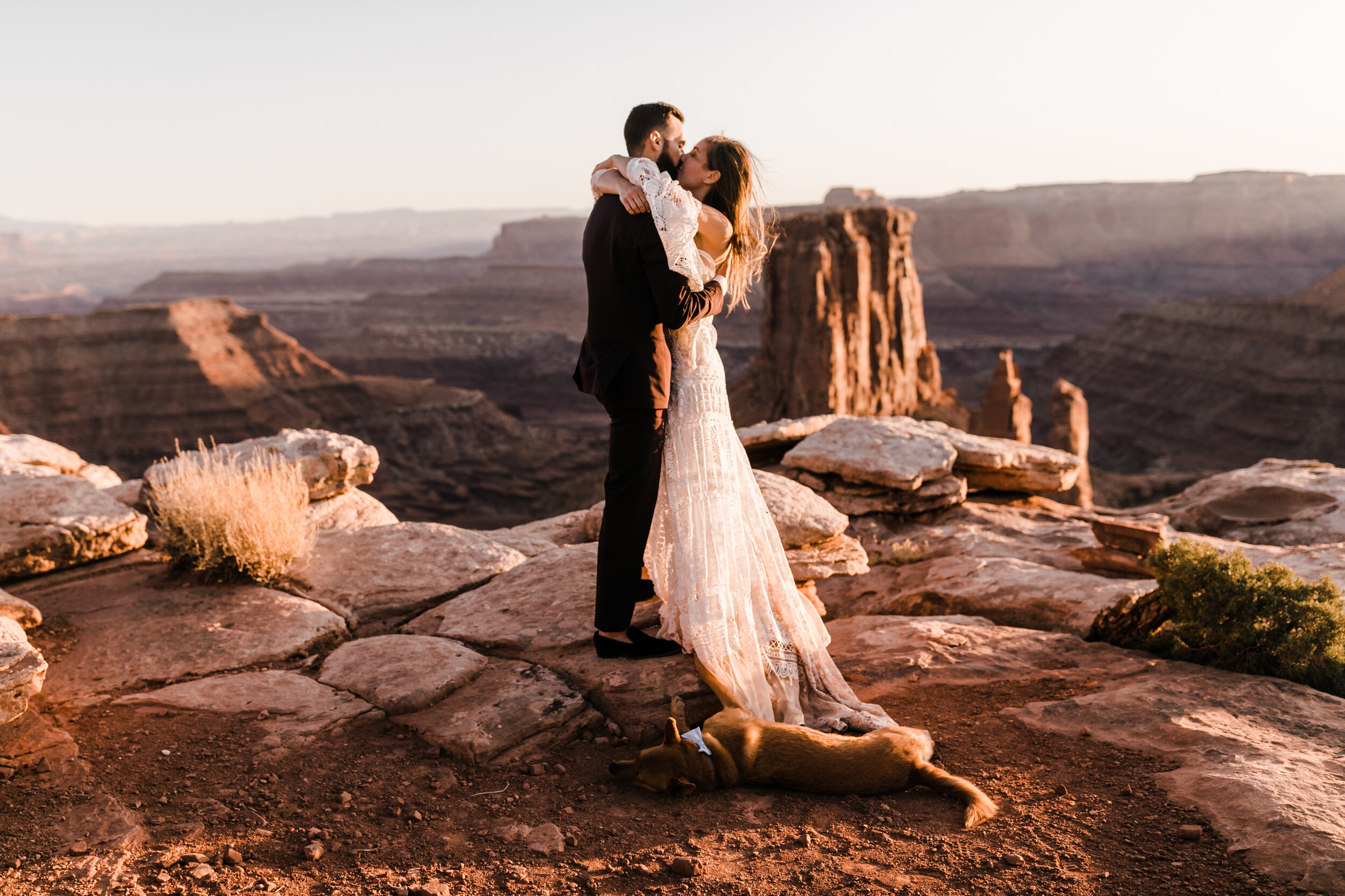 Adventurous jeep elopement in Moab, Utah | Rue de Seine Boho Desert Bride | Maroon Suit | Wedding with a dog | The Hearnes Adventure Photography