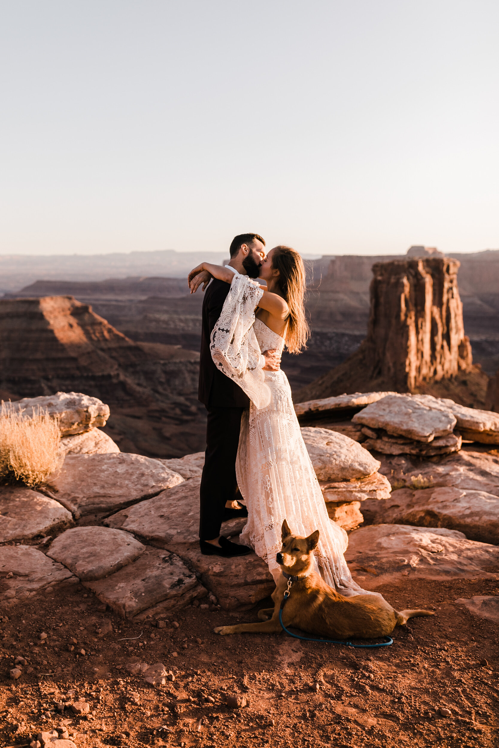 Adventurous jeep elopement in Moab, Utah | Rue de Seine Boho Desert Bride | Maroon Suit | Wedding with a dog | The Hearnes Adventure Photography