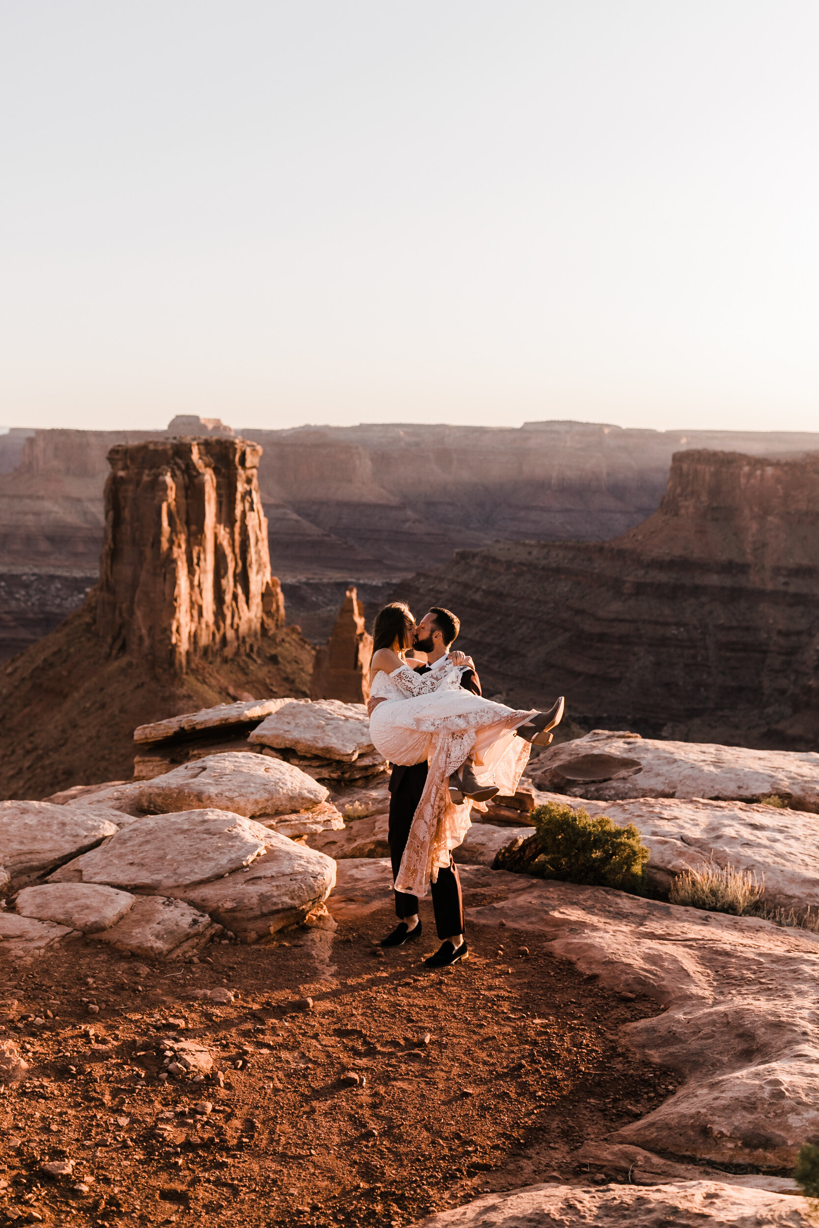 Adventurous jeep elopement in Moab, Utah | Rue de Seine Boho Desert Bride | Maroon Suit | Wedding with a dog | The Hearnes Adventure Photography