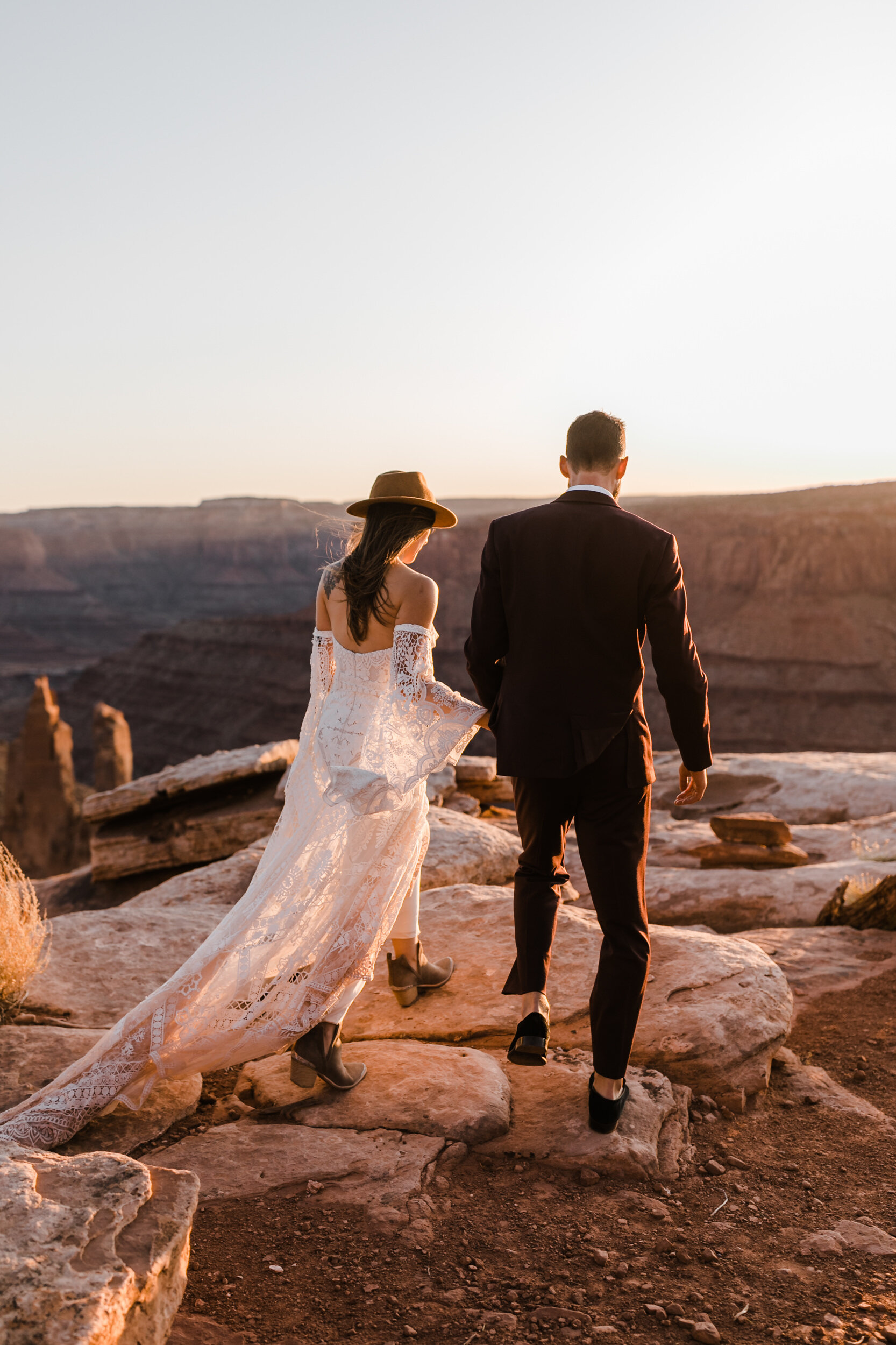 Adventurous jeep elopement in Moab, Utah | Rue de Seine Boho Desert Bride | Maroon Suit | Wedding with a dog | The Hearnes Adventure Photography