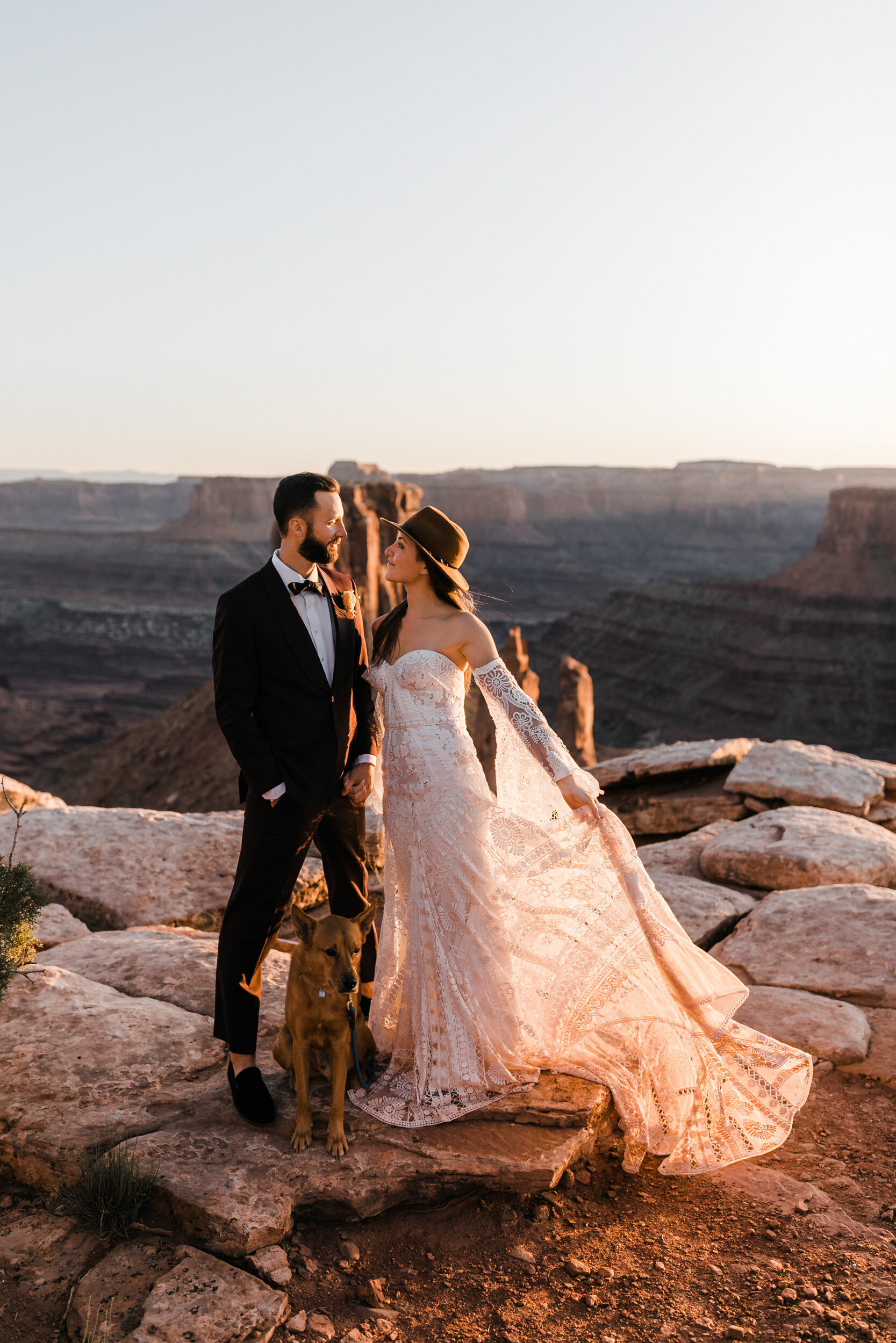 Adventurous jeep elopement in Moab, Utah | Rue de Seine Boho Desert Bride | Maroon Suit | Wedding with a dog | The Hearnes Adventure Photography