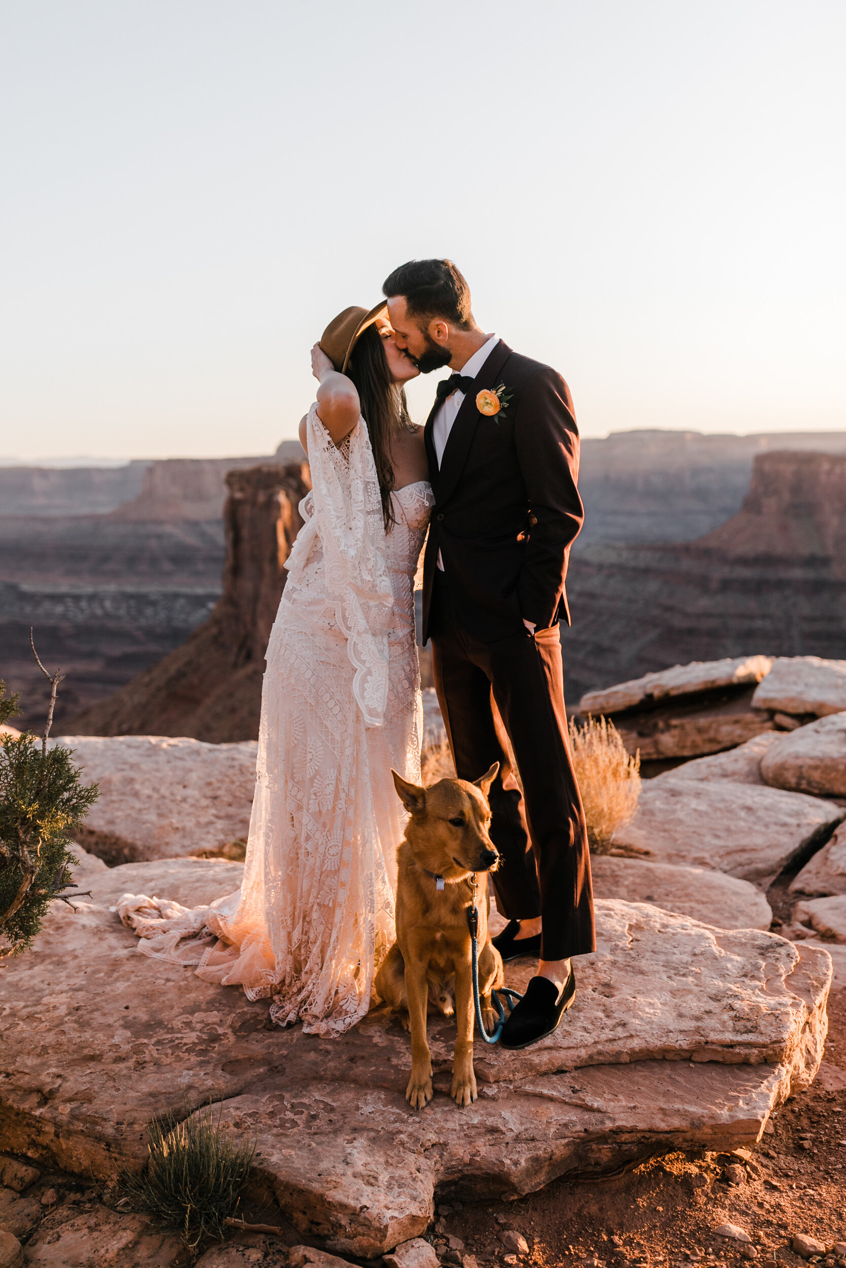 Adventurous jeep elopement in Moab, Utah | Rue de Seine Boho Desert Bride | Maroon Suit | Wedding with a dog | The Hearnes Adventure Photography