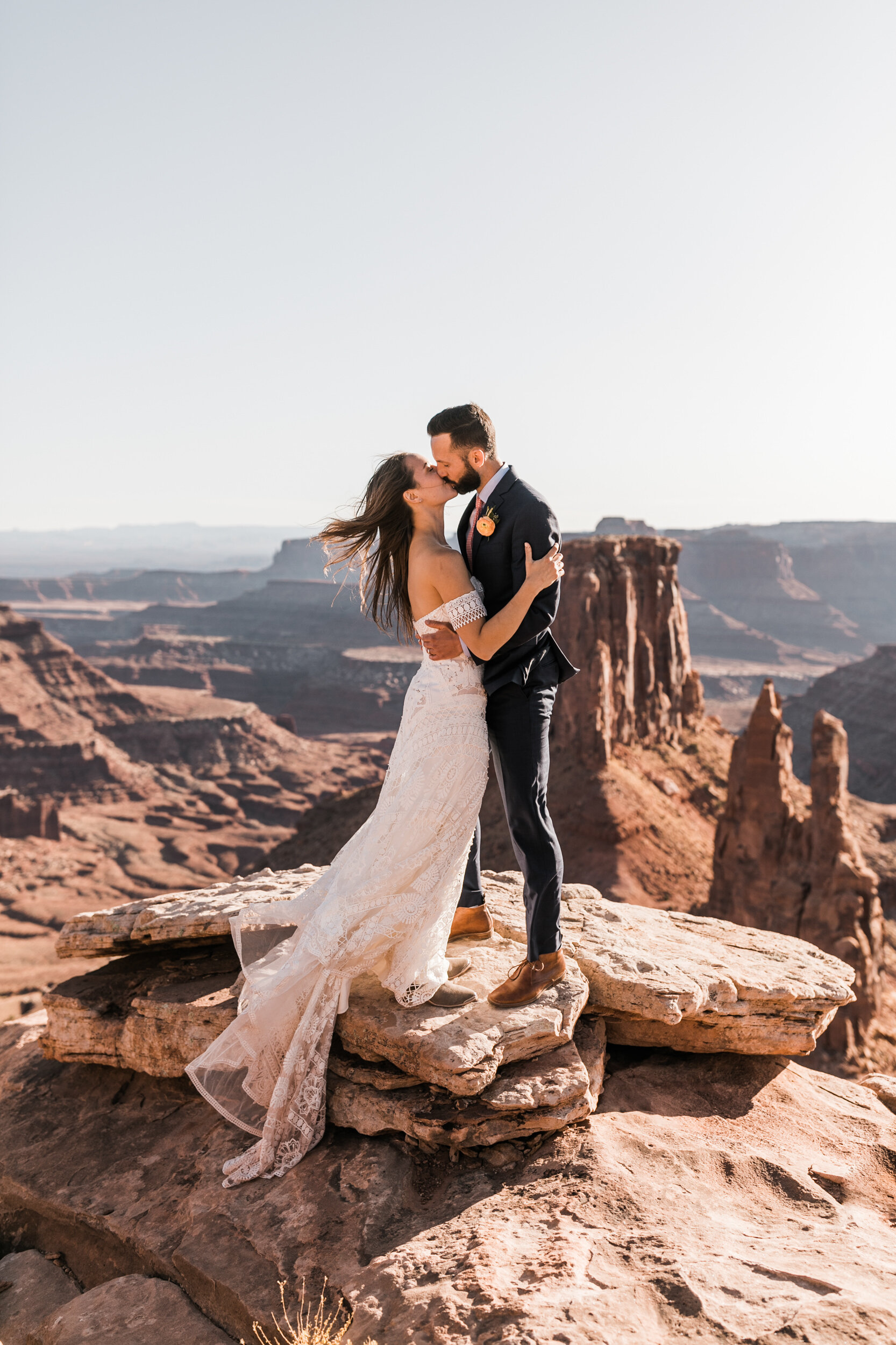 Adventurous jeep elopement in Moab, Utah | Rue de Seine Boho Desert Bride | Maroon Suit | Wedding with a dog | The Hearnes Adventure Photography