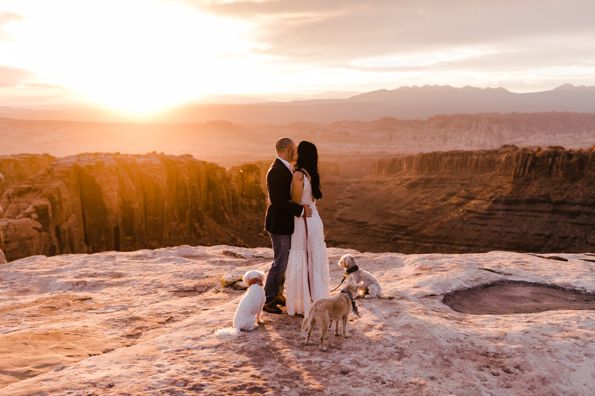 kimi + brett’s sunrise engagement photos in Moab, Utah with their dogs | utah elopement photographers | the hearnes adventure photography