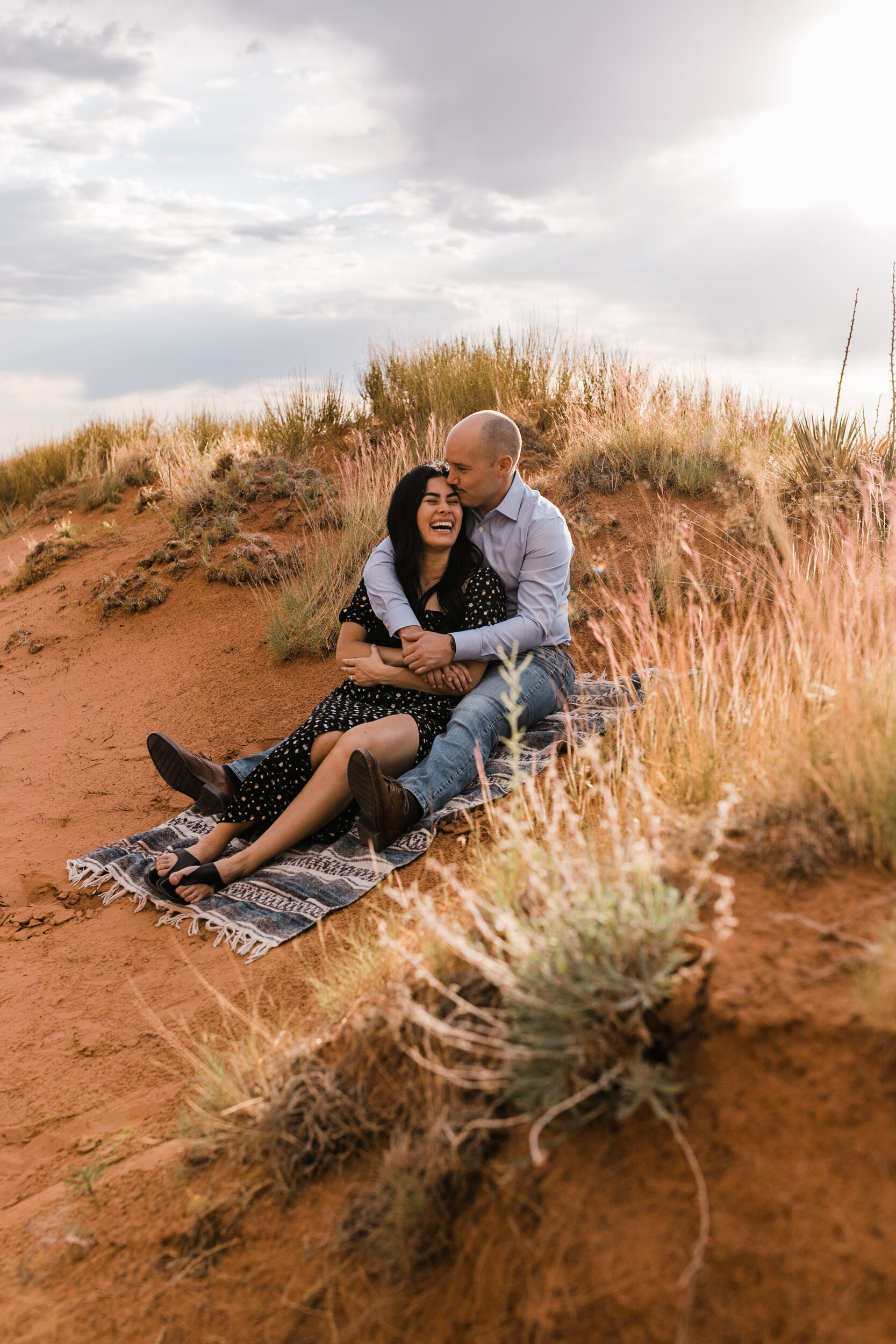 kimi + brett’s sunrise engagement photos in Moab, Utah with their dogs | utah elopement photographers | the hearnes adventure photography