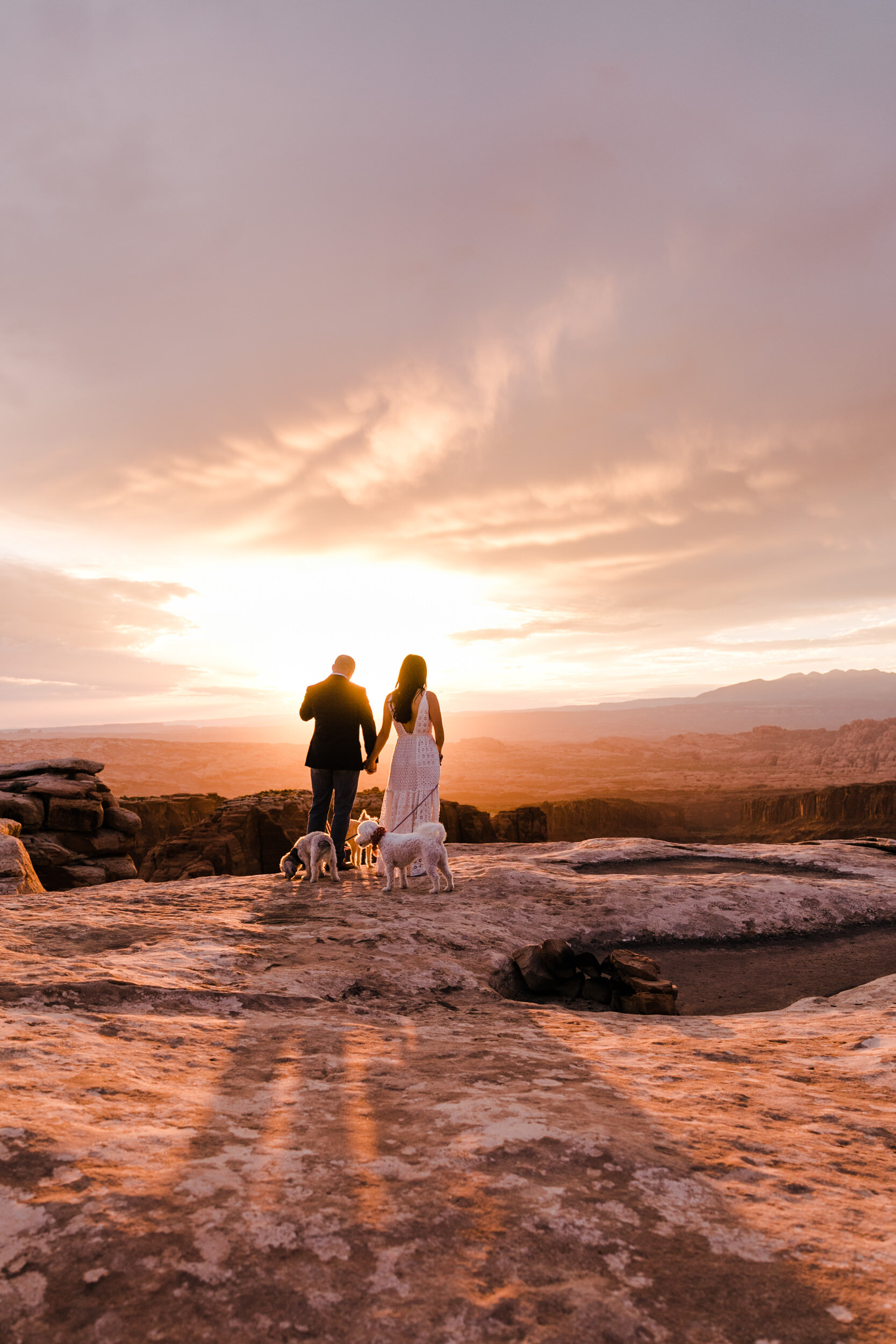 kimi + brett’s sunrise engagement photos in Moab, Utah with their dogs | utah elopement photographers | the hearnes adventure photography