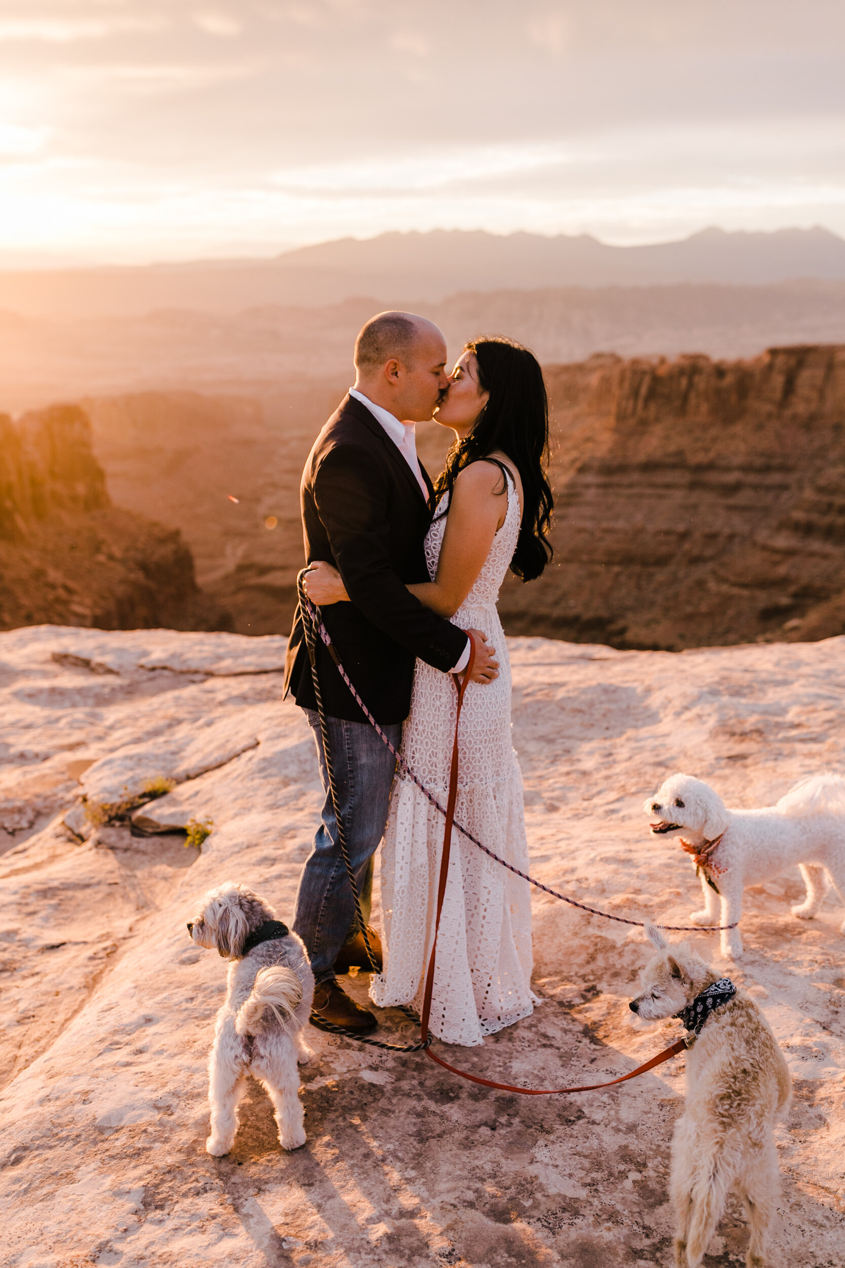 kimi + brett’s sunrise engagement photos in Moab, Utah with their dogs | utah elopement photographers | the hearnes adventure photography