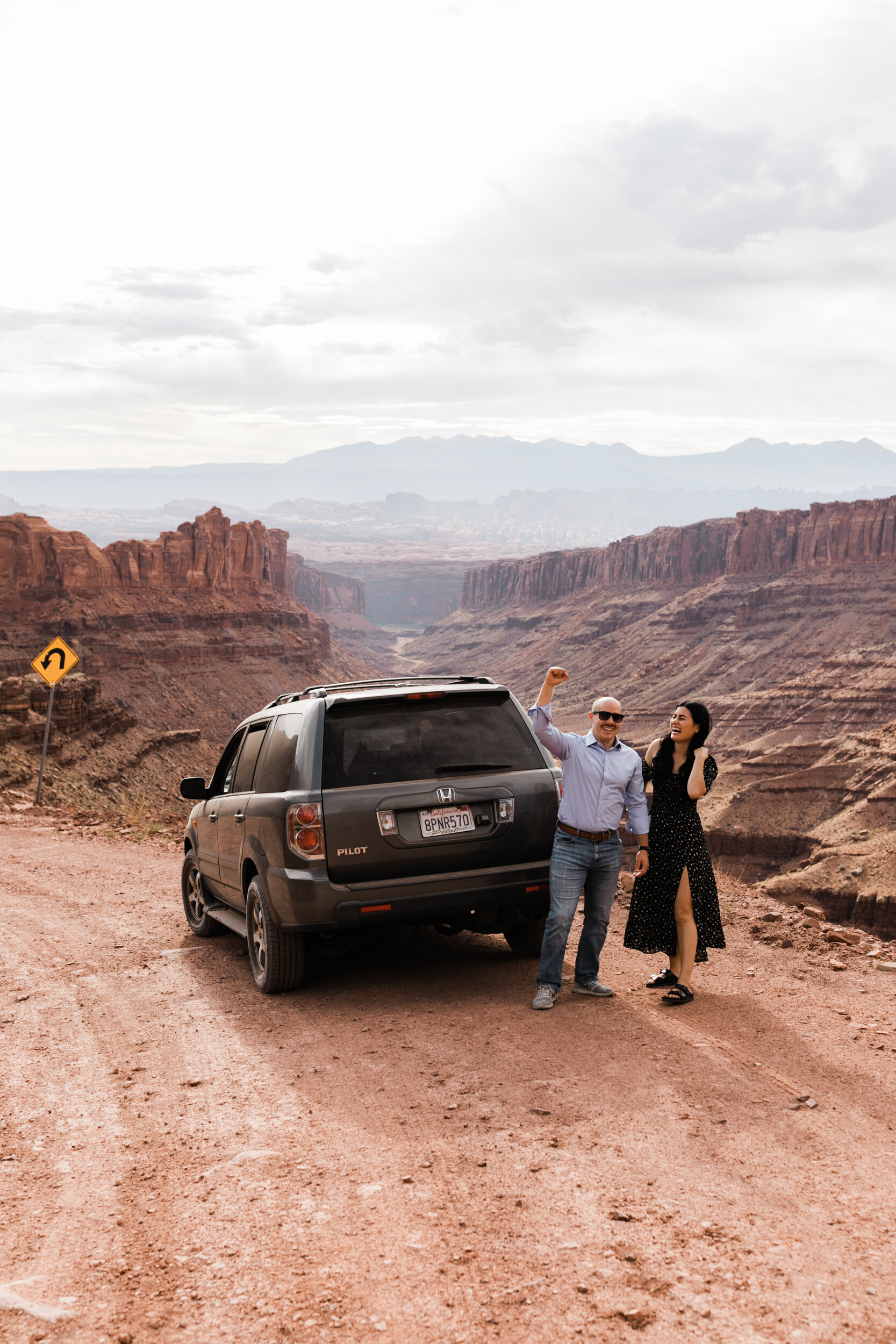 kimi + brett’s sunrise engagement photos in Moab, Utah with their dogs | utah elopement photographers | the hearnes adventure photography