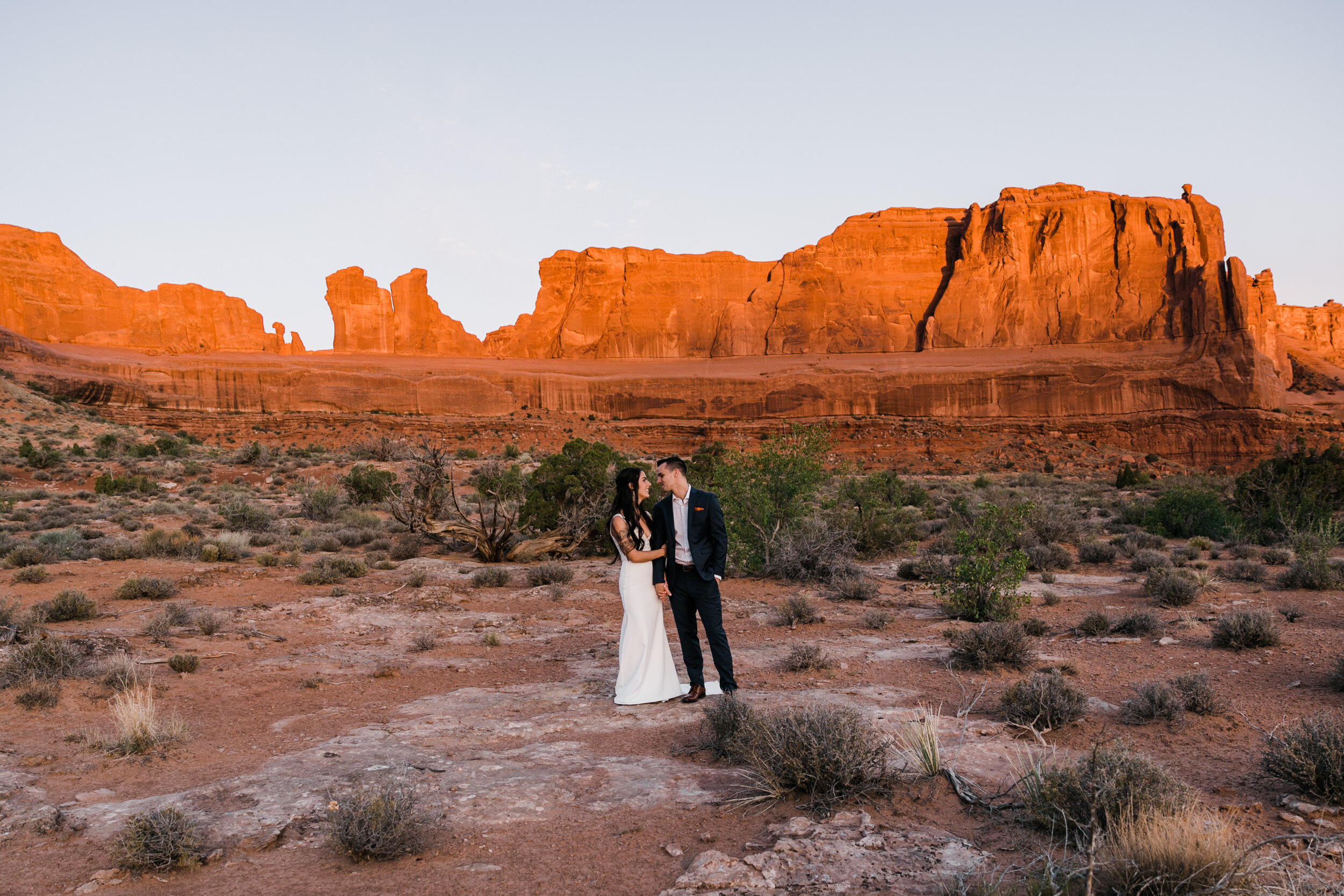 Sunrise elopement first look in Arches national park  | moab adventure wedding | the hearnes photography