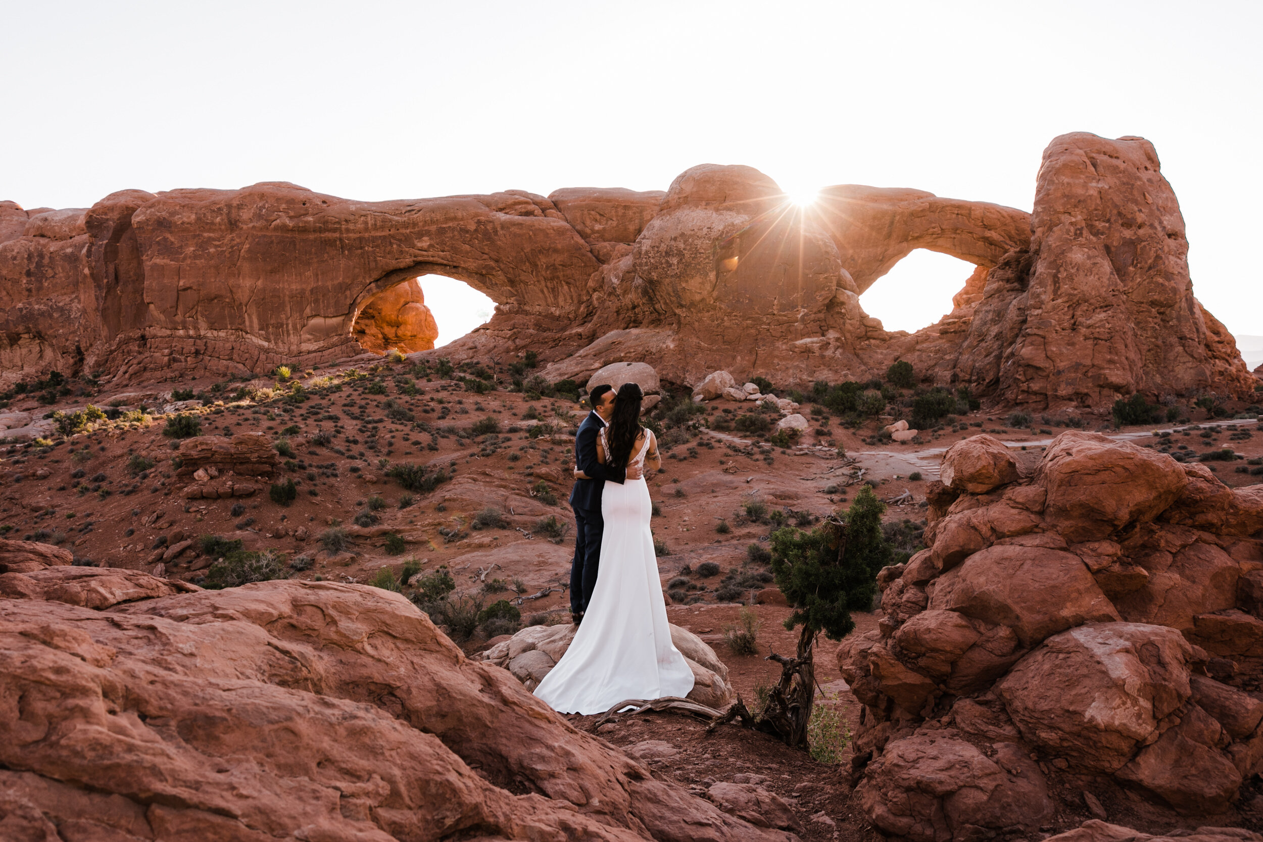 Sunrise elopement first look in Arches national park  | moab adventure wedding | the hearnes photography