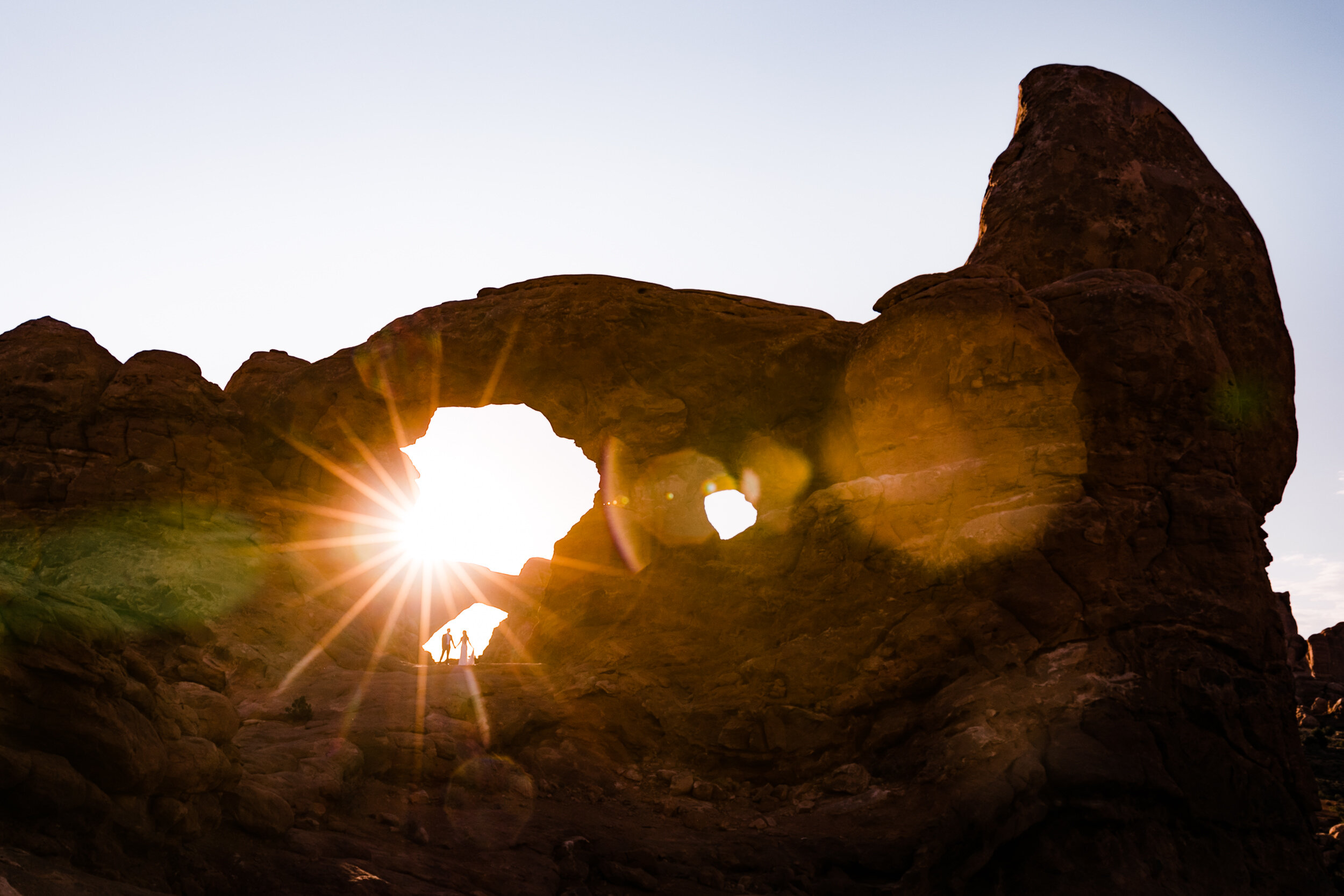 Sunrise elopement first look in Arches national park  | moab adventure wedding | the hearnes photography