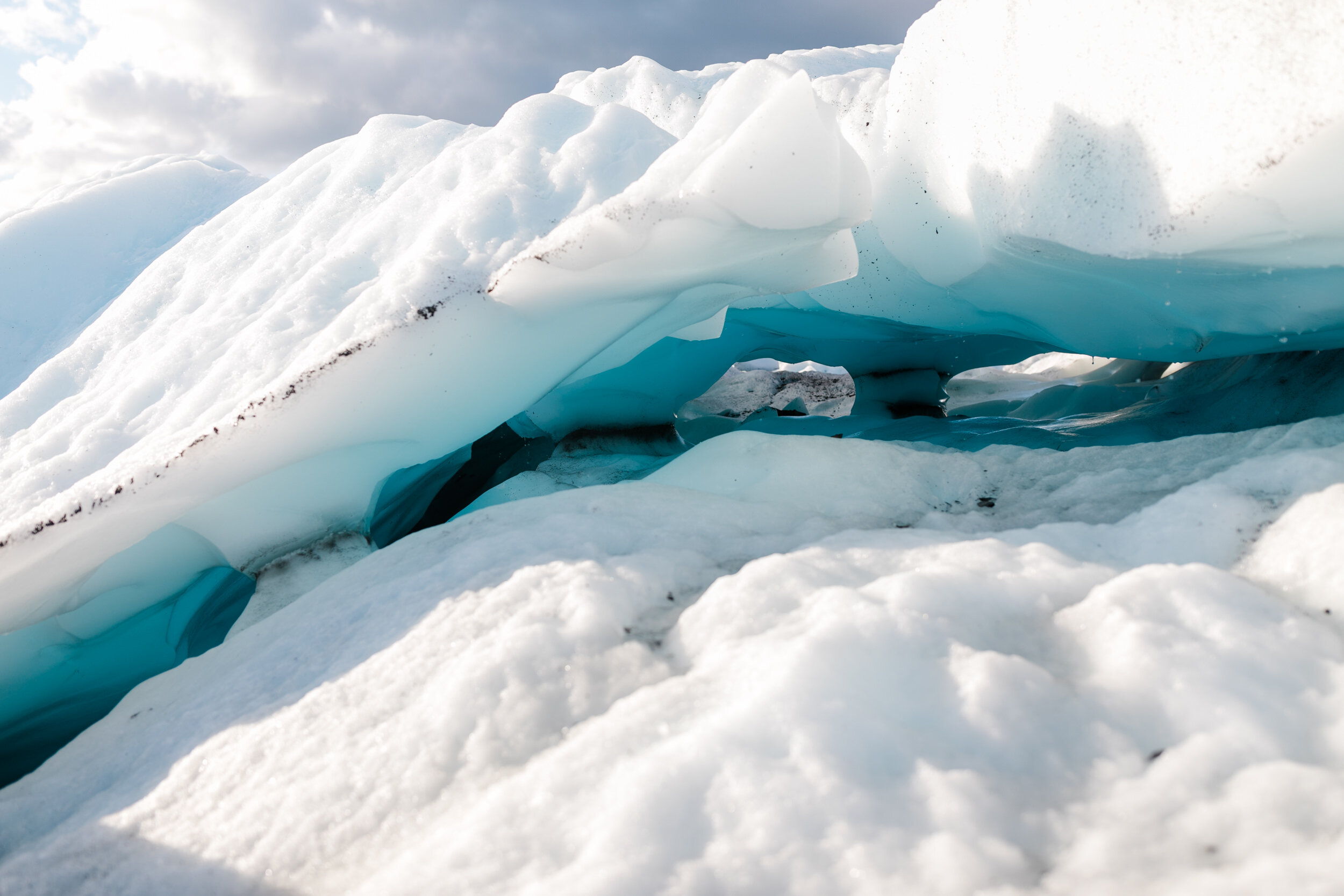 Glacier Hiking Elopement in Alaska | Day-After Wedding Session | Blush Wedding Dress | Dark Green Groom Suit | The Hearnes Adventure Photography