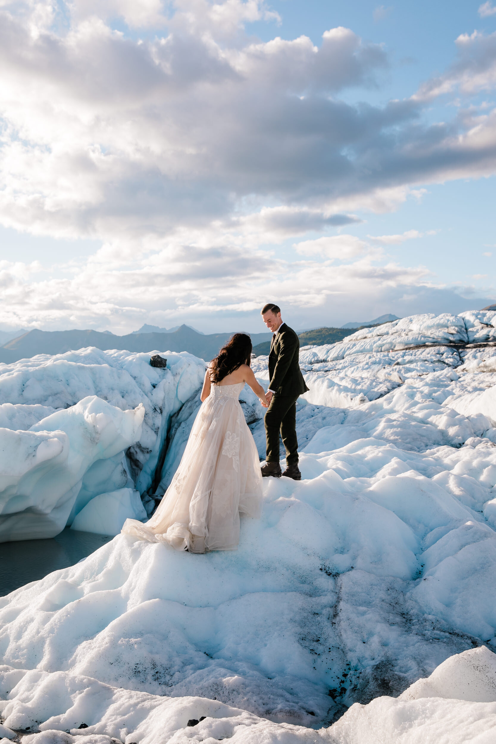 Glacier Hiking Elopement in Alaska | Day-After Wedding Session | Blush Wedding Dress | Dark Green Groom Suit | The Hearnes Adventure Photography