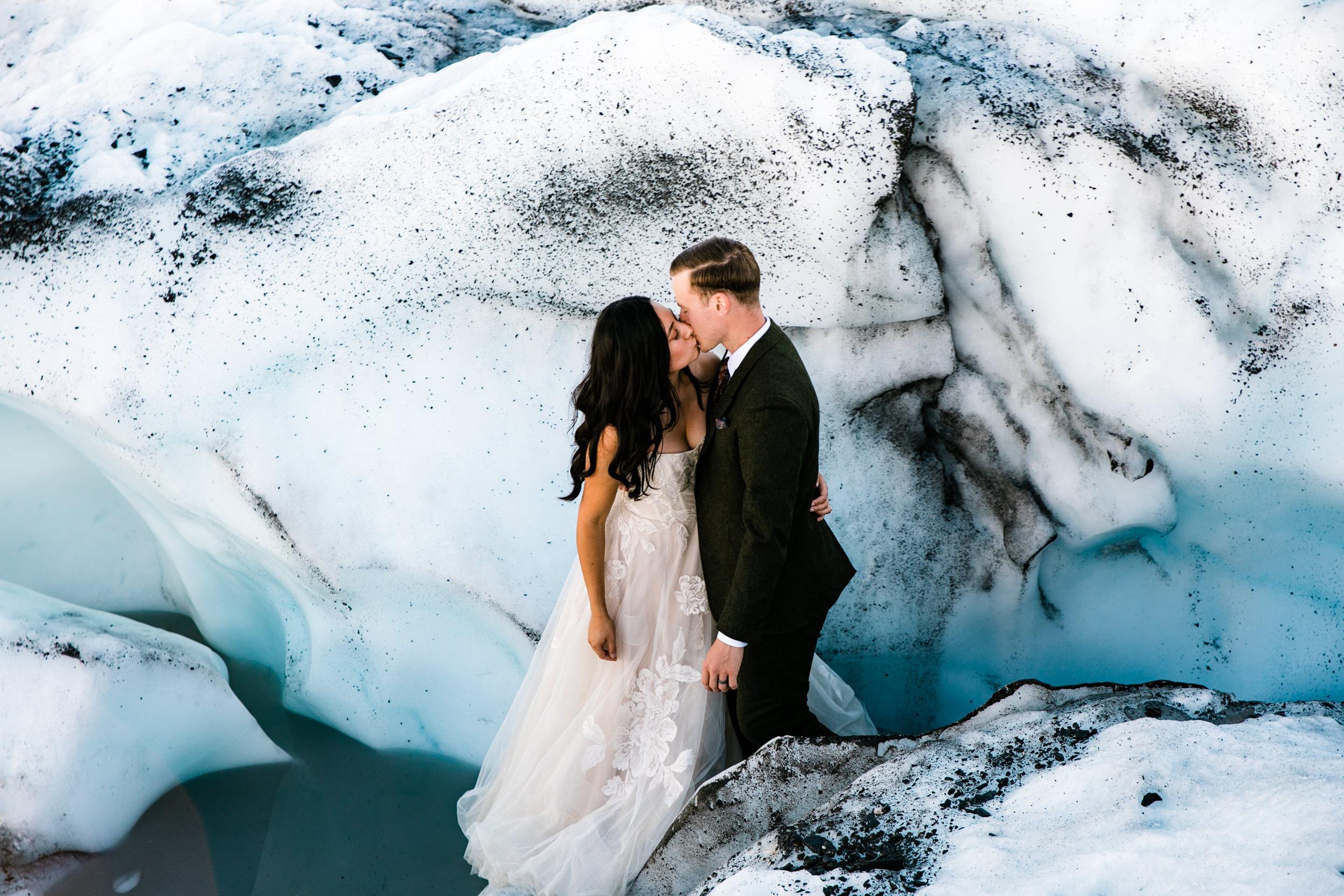 Glacier Hiking Elopement in Alaska | Day-After Wedding Session | Blush Wedding Dress | Dark Green Groom Suit | The Hearnes Adventure Photography