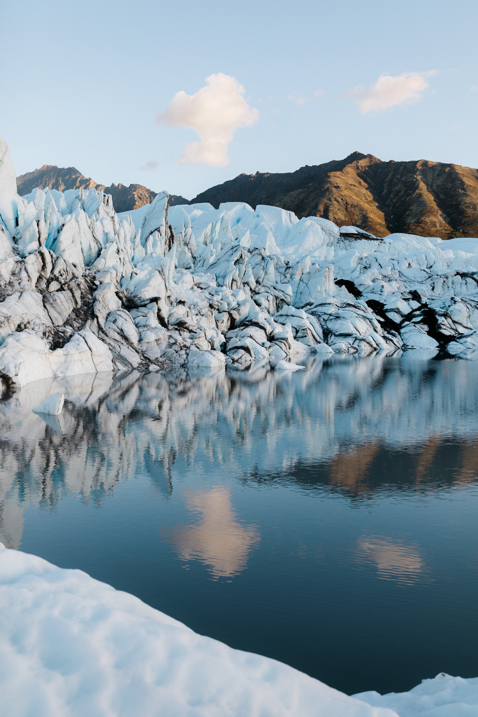 Glacier Hiking Elopement in Alaska | Day-After Wedding Session | Blush Wedding Dress | Dark Green Groom Suit | The Hearnes Adventure Photography