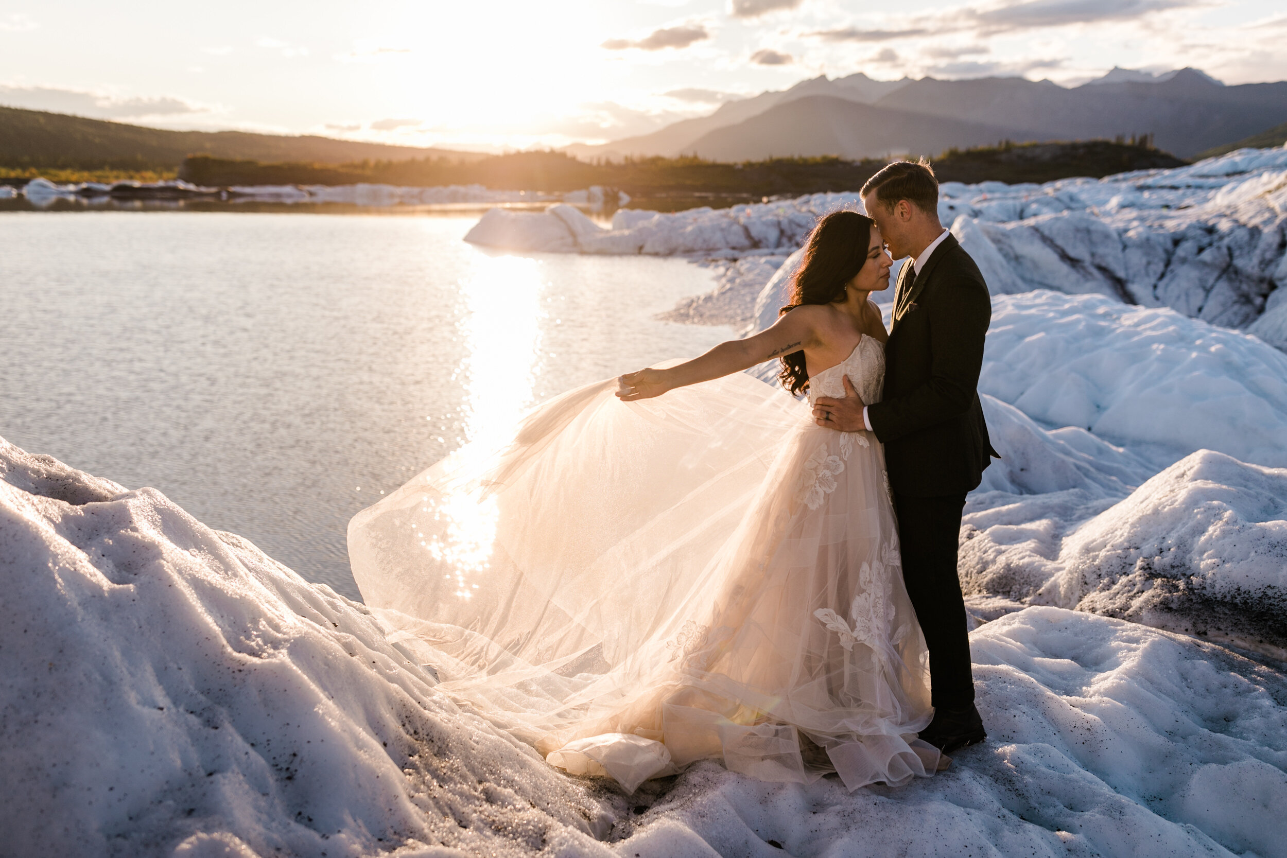 Glacier Hiking Elopement in Alaska | Day-After Wedding Session | Blush Wedding Dress | Dark Green Groom Suit | The Hearnes Adventure Photography