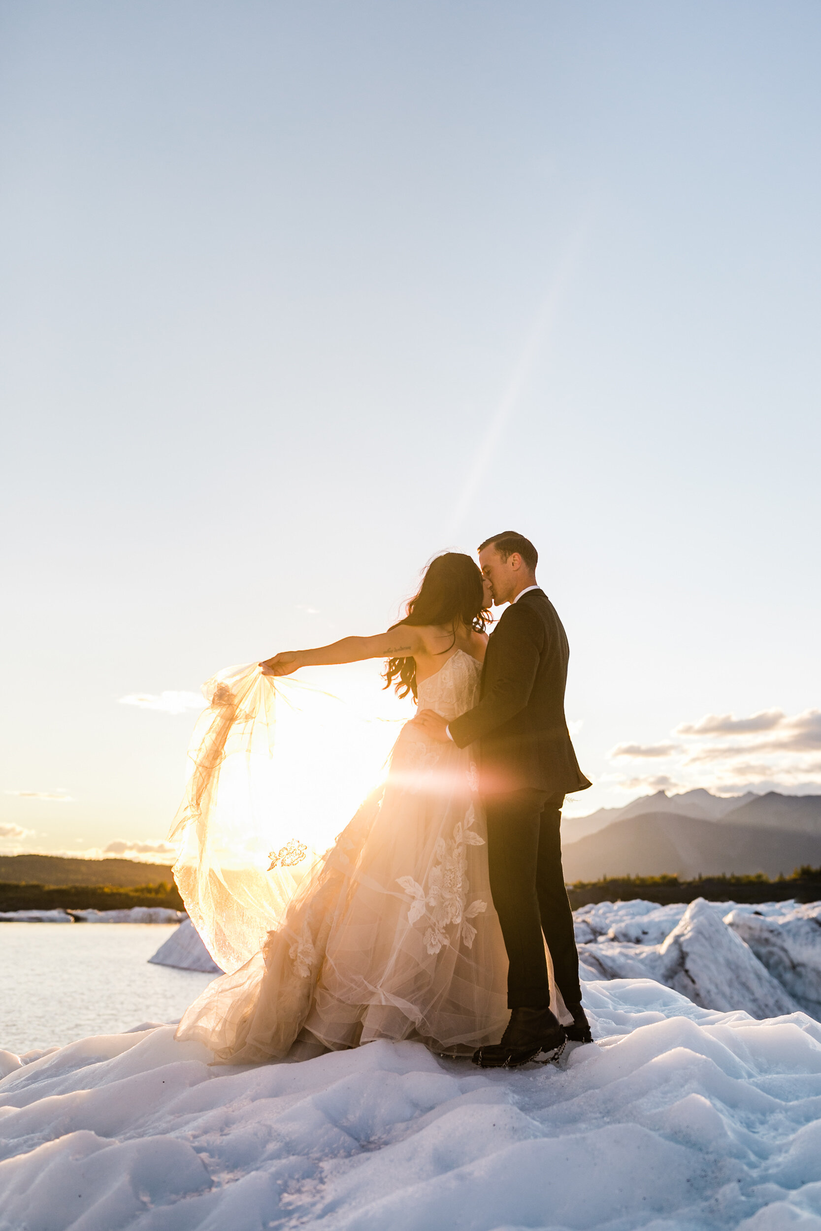 Glacier Hiking Elopement in Alaska | Day-After Wedding Session | Blush Wedding Dress | Dark Green Groom Suit | The Hearnes Adventure Photography